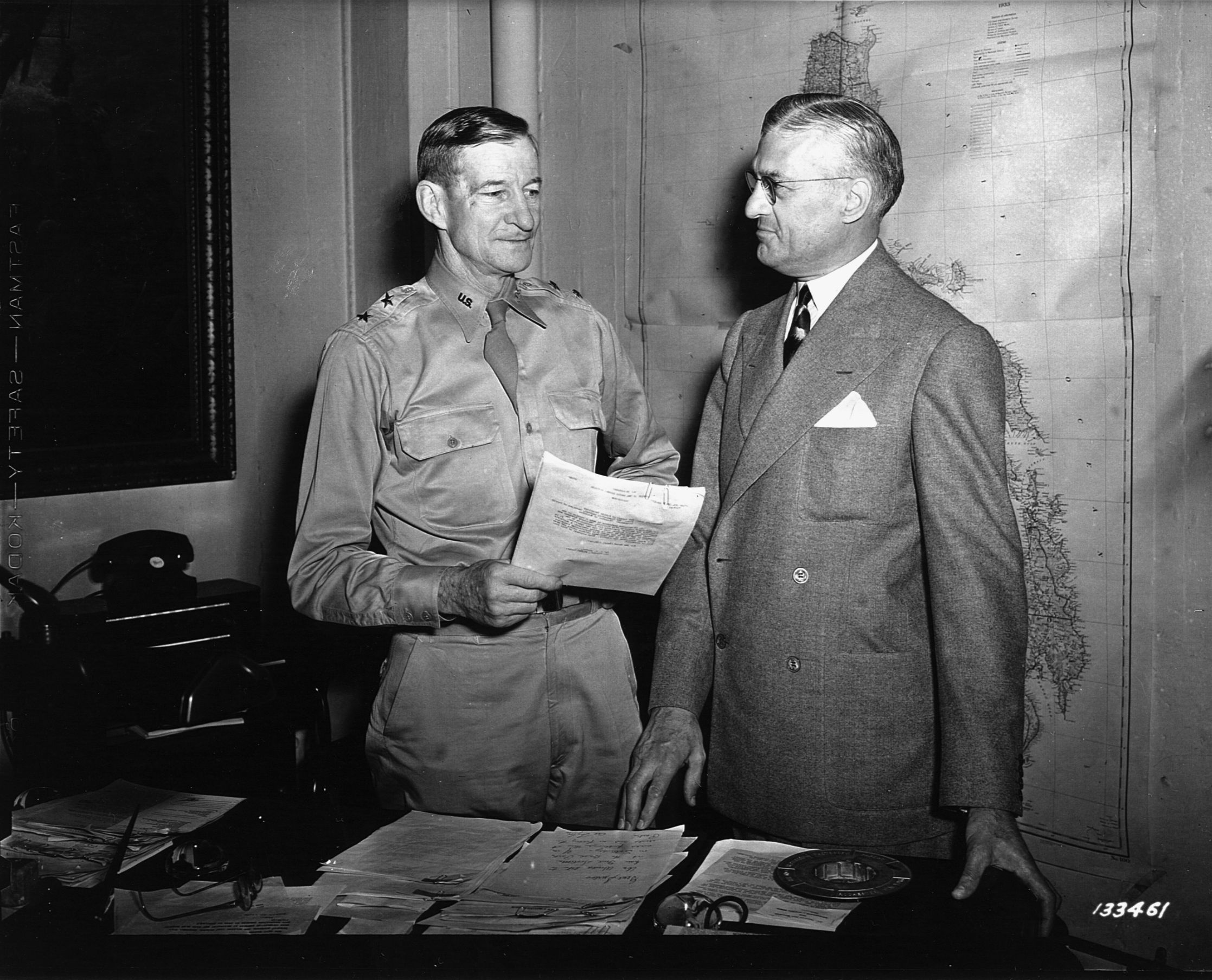 Major General Alexander D. Surles (left) confers with National League President Ford Fick in May 1942.