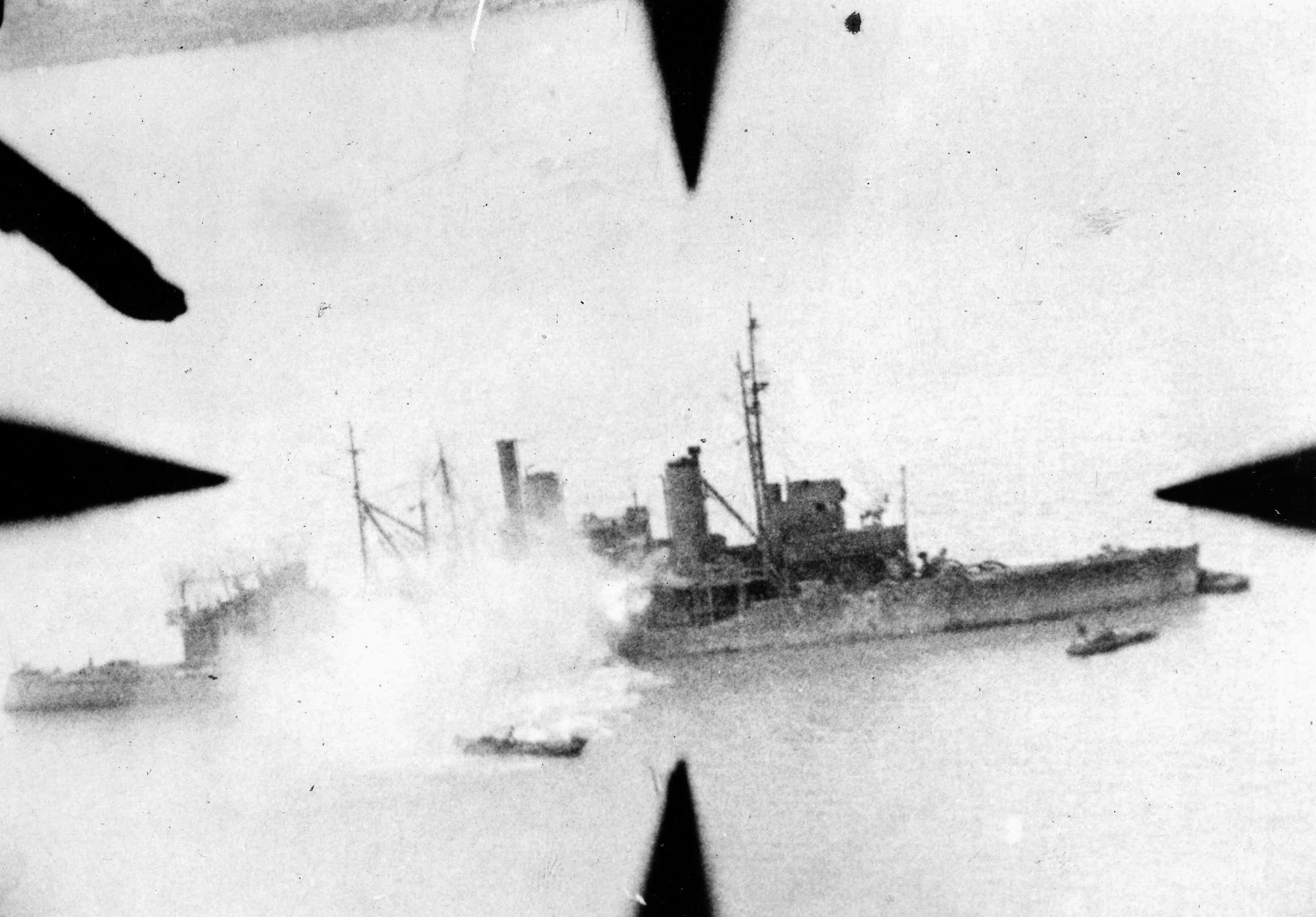 A bomb hit on a Japanese patrol boat is recorded by a photographer aboard an American aircraft. During the same mission in which they sank this vessel off the Shantung Peninsula, pilots of the U.S. Fourteenth Air Force destroyed 45 Japanese planes on the ground and damaged 55 others.