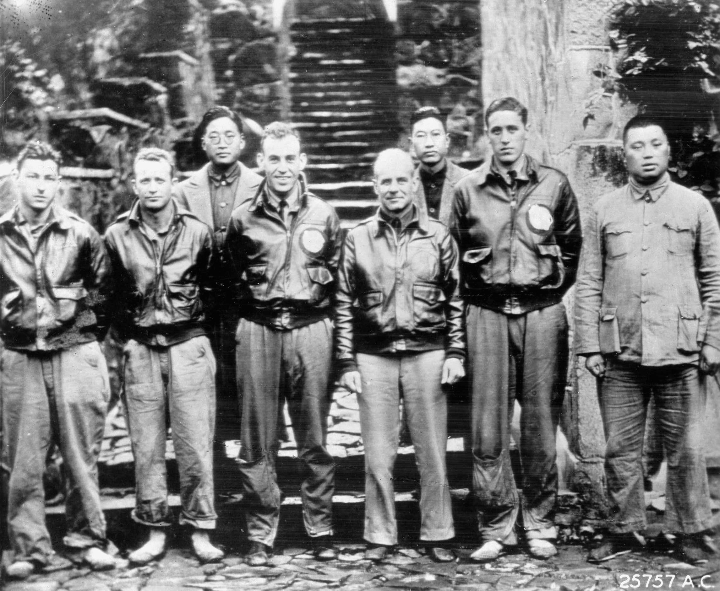 Lieutenant Colonel and future General Jimmy Doolittle poses with several of his fellow survivors of the famed April 1942 raid on Tokyo. Also pictured is one of the friendly Chinese who risked their lives to shelter the raiders from the vengeful Japanese.