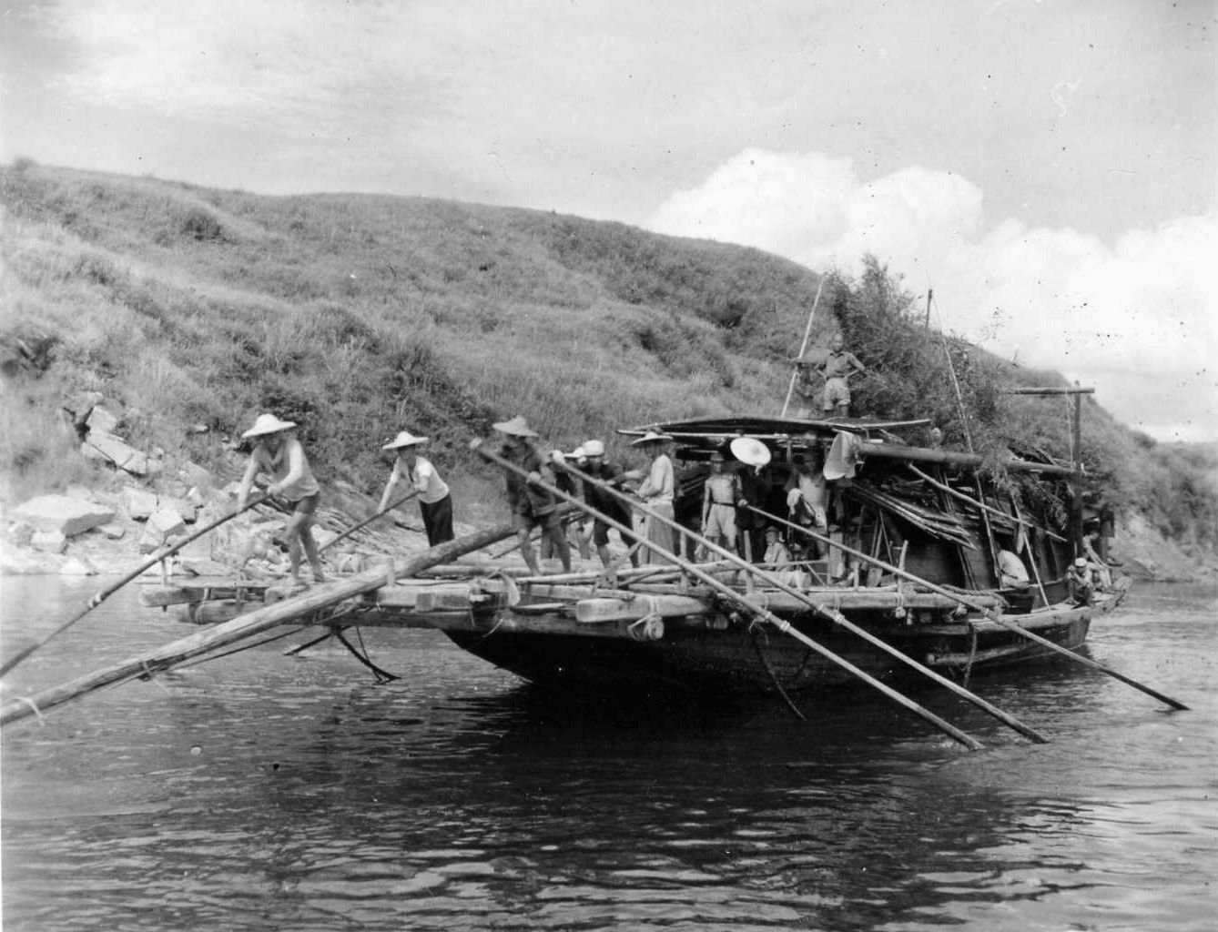 Laden with Chinese commandos, sampans make their way down the Liu River en route to attack Japanese positions in the hills near Tanchuk. Following the defeat of the Japanese, the Communist and Nationalist factions in China renewed their civil war.