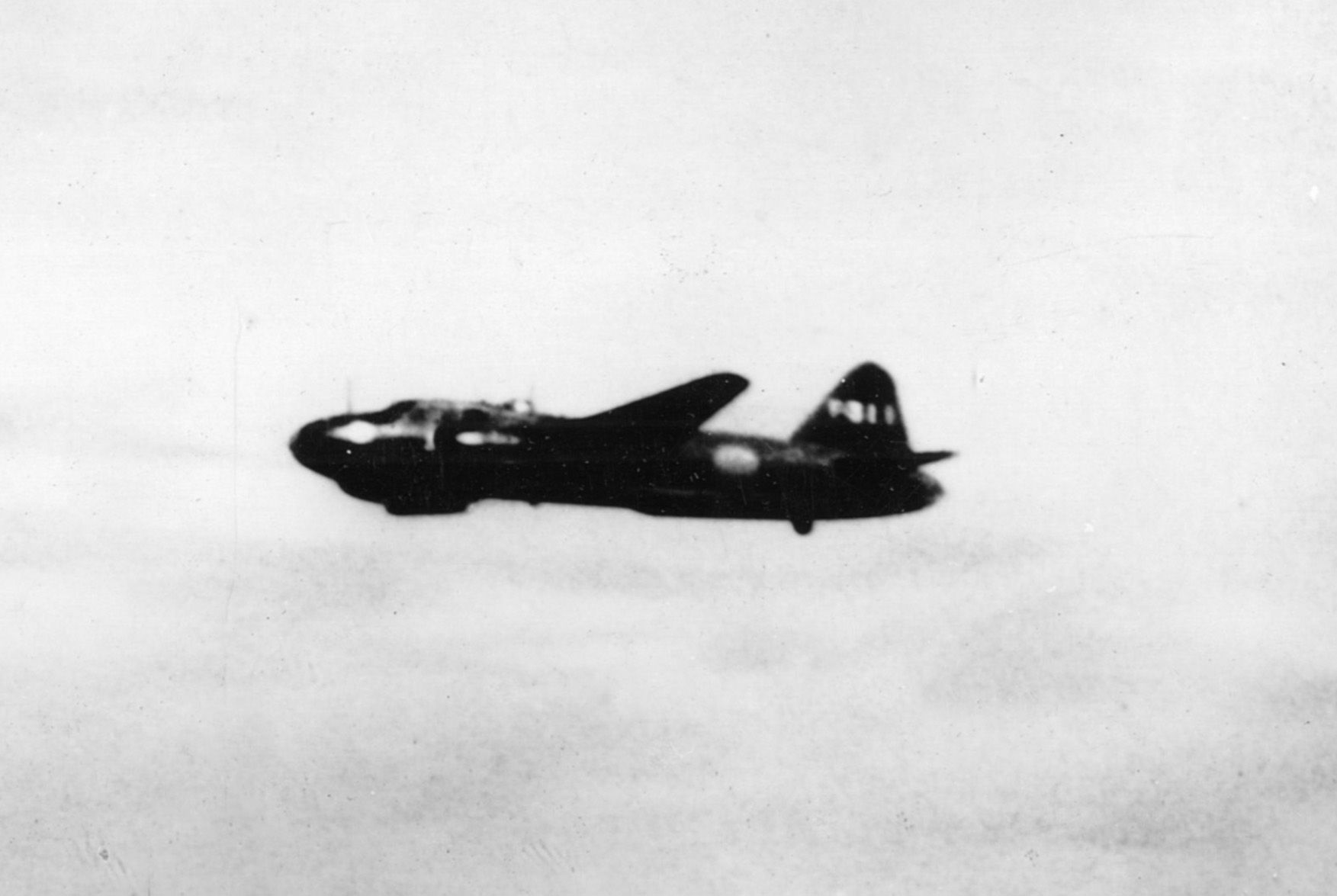 A Japanese Mitsubishi “Betty” bomber is photographed from the Chicago on July 7, 1942. The versatile Betty could carry torpedoes or bombs.
