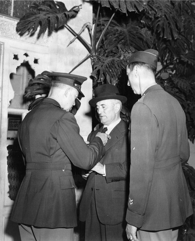 Pointing his finger at the chest of Admiral Jean Francois Darlan, General Dwight D. Eisenhower, overall commander for Operation Torch, stresses a concern with the Vichy diplomat. General Mark Clark listens intently in this photo, which was taken on November 13, 1942, five days after the Torch landings.