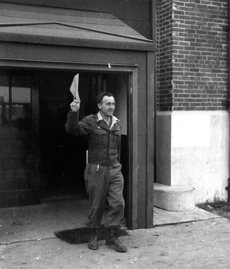 It’s official. With his discharge in hand, ex-Staff Sergeant George H. Faulkner, 3106617, of Company B, 422nd Infantry Regiment, 106th Infantry Division, leaves the separation center as a “Mister.”