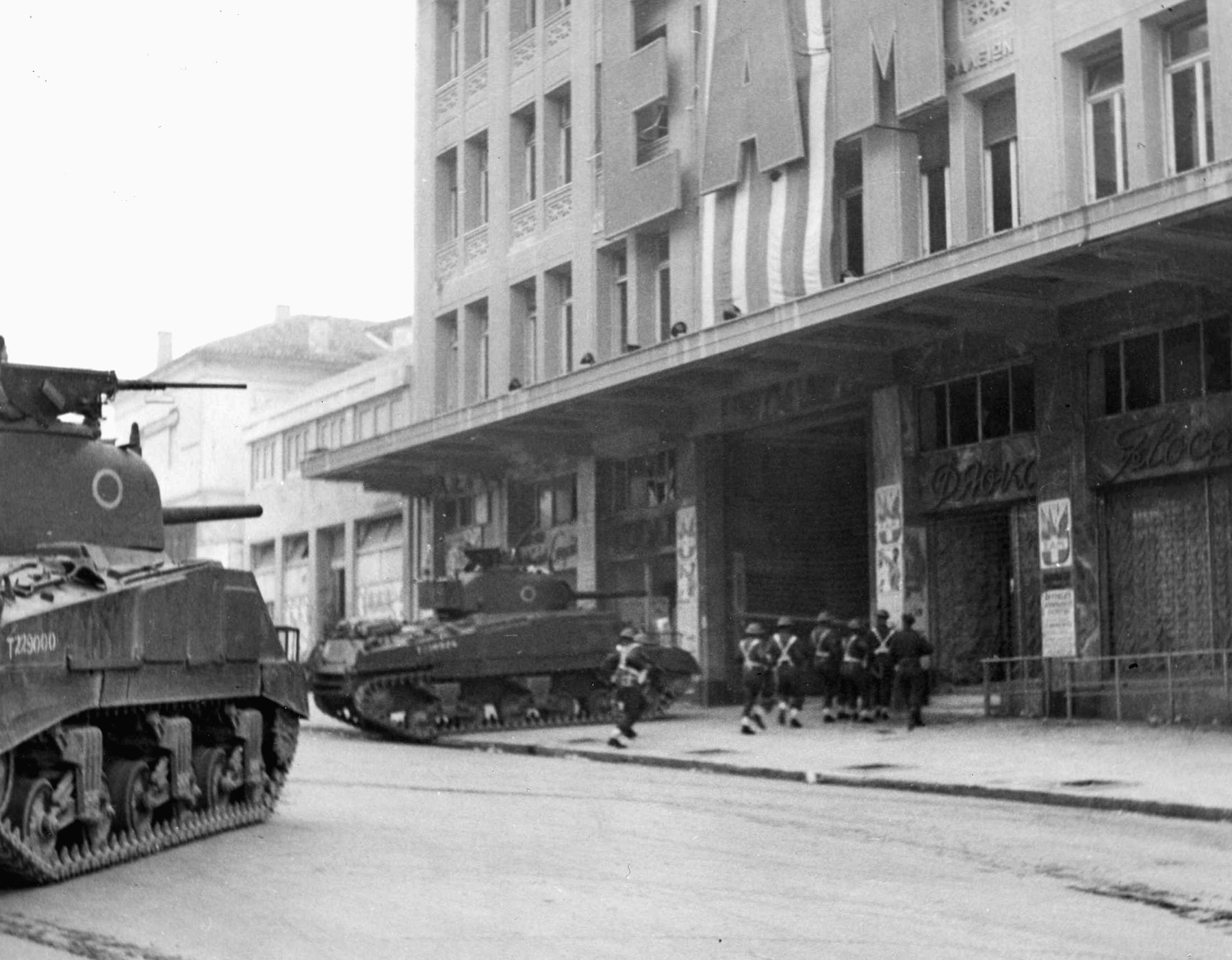  A British tank crashes through the door of the EAM Building in Athens during the effort to crush resistance by the Communist ELAS guerrillas. The Communists put up stiff resistance for several days.