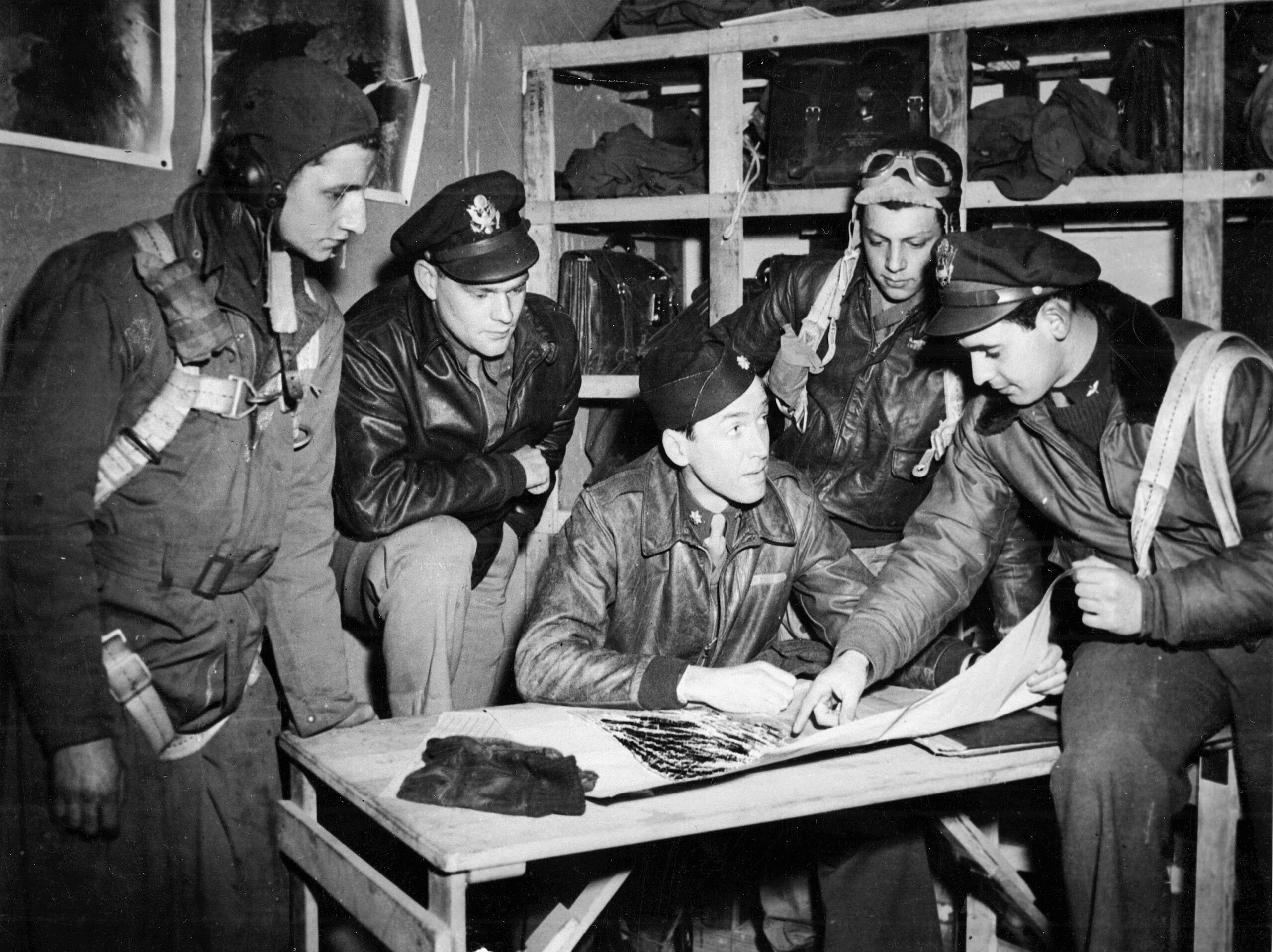 Major James Stewart briefs members of the 453rd Bomb Group before a mission.
