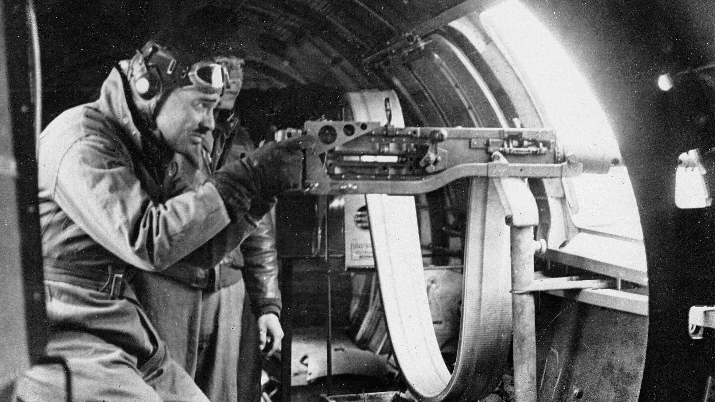 After OCS and gunnery school, Clark Gable was assigned to the 351st Bomb Group in Polebrook, England. Here he demonstrates the techniques for handing a waist gun.