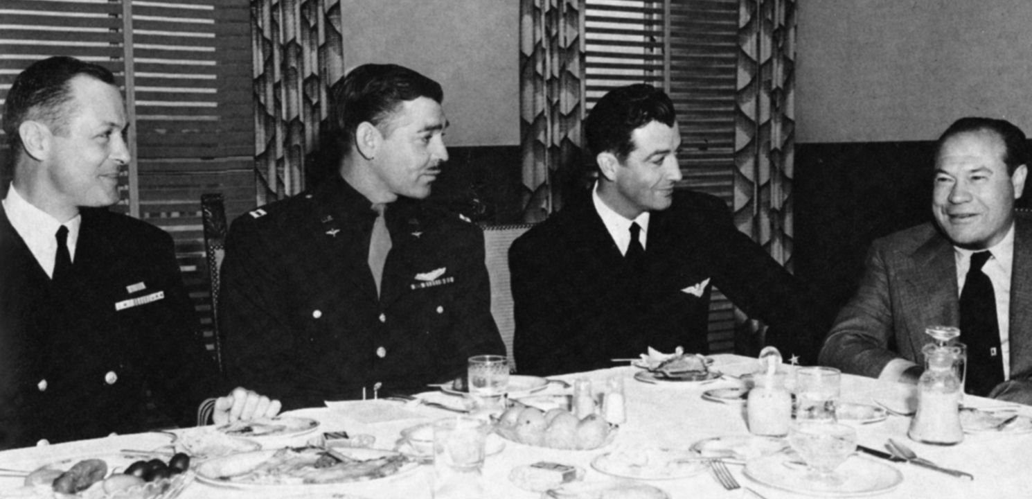Returning heroes (l to r): Lt. Cmdr. Robert Montgomery, Major Clark Gable, and Lt. (jg) Robert Taylor with MGM executive Eddie Mannix.