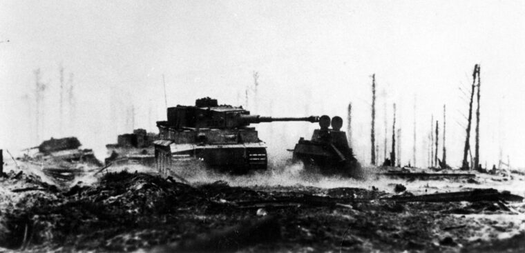 Silhouetted against a battle-scarred landscape, a German Tiger tank is seen in action at Kursk on July 13, 1943.
