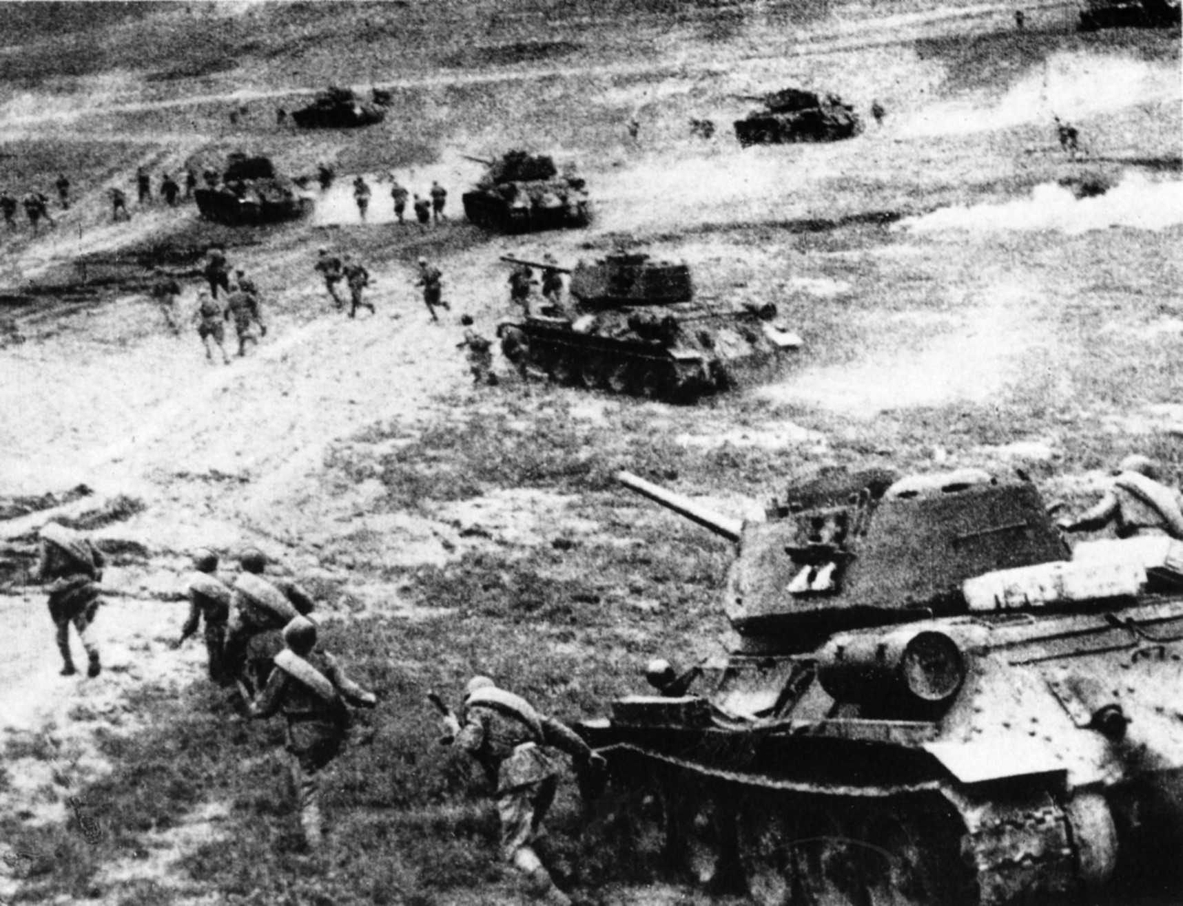Soviet T-34 tanks, supported by thousands of Red Army soldiers, advance rapidly during a counter-attack at Kursk. The resurgent Soviet military managed to contain the German offensive and later undertake its drive on Berlin.