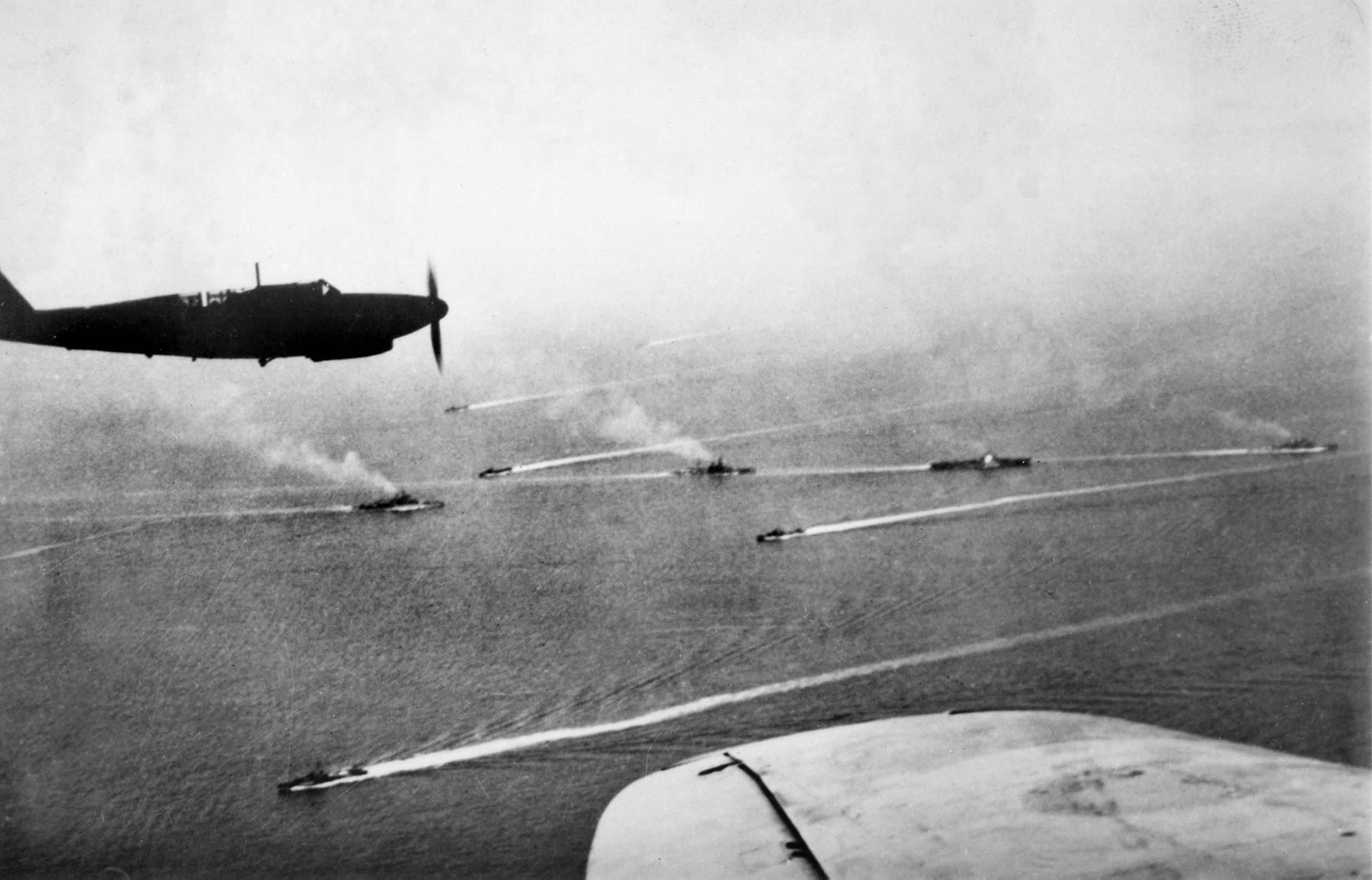 Photographed in the Ionian Sea at the time of the Battle of Cape Matapan, British warships are seen from the air. The plane in the photo is a British Fairey Fulmar.