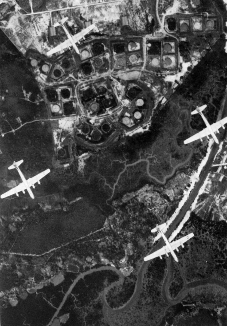 Flying above Singapore on March 2, 1945, B-29 bombers head for a target in Southeast Asia.