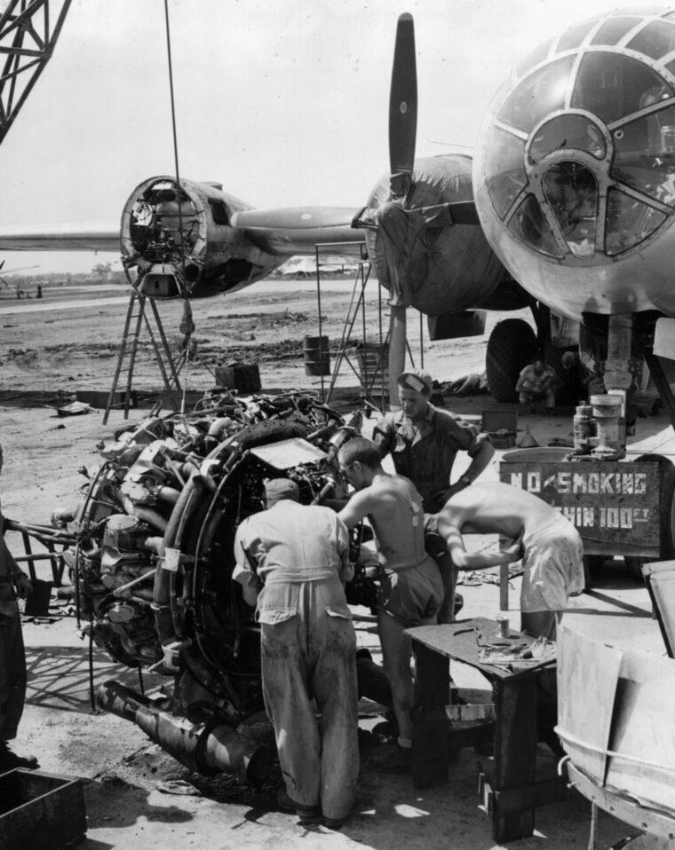 Ground crewmen tune up one of the B-29’s four engines prior to reinstallation. The huge bomber was the first to have a pressurized cabin for its flight crew.