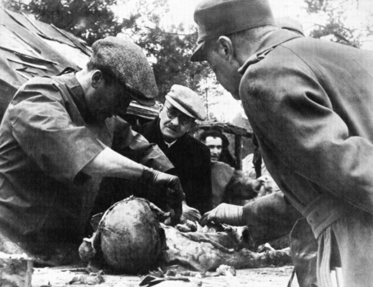 A pathologist dissects a body unearthed in the Katyn Forest during a German investigation of the incident.A pathologist dissects a body unearthed in the Katyn Forest during a German investigation of the incident.