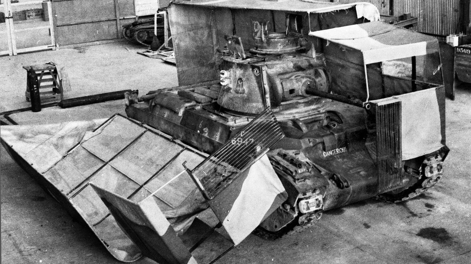 Located at Helwan, Egypt, the Middle East Command Camouflage Development and Training Center was a think tank and laboratory for the deception efforts of A Force. Taken in 1941, this photo shows a British tank with its sunshield split during vehicle servicing on the workshop floor.