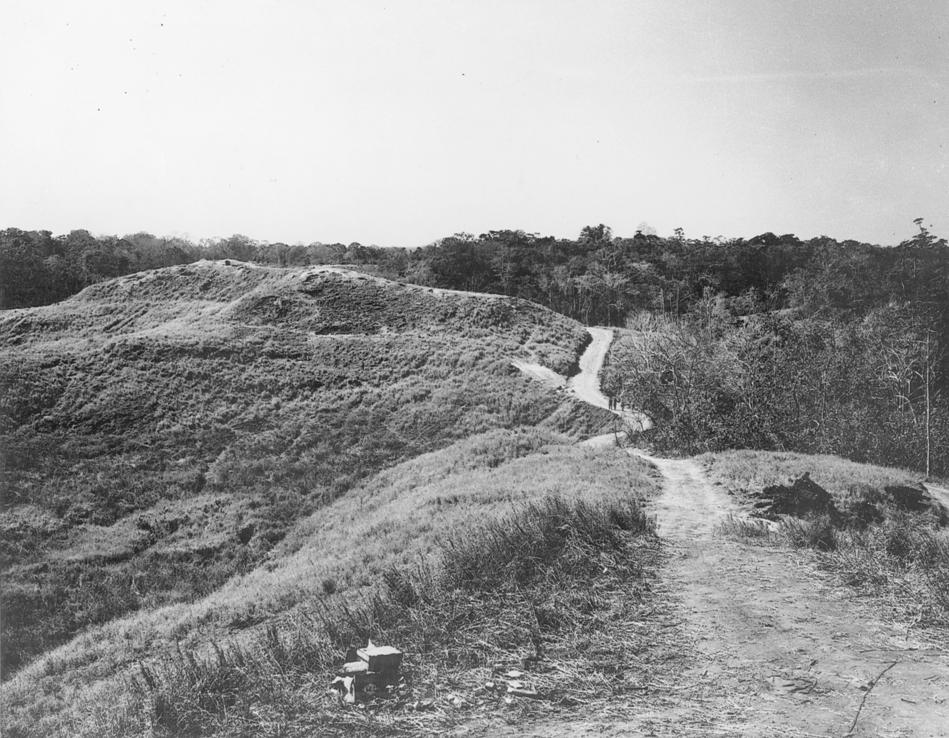 After fierce fighting at Bloody Ridge, Marines come off line, following a winding dirt path across the hills of Guadalcanal. 
