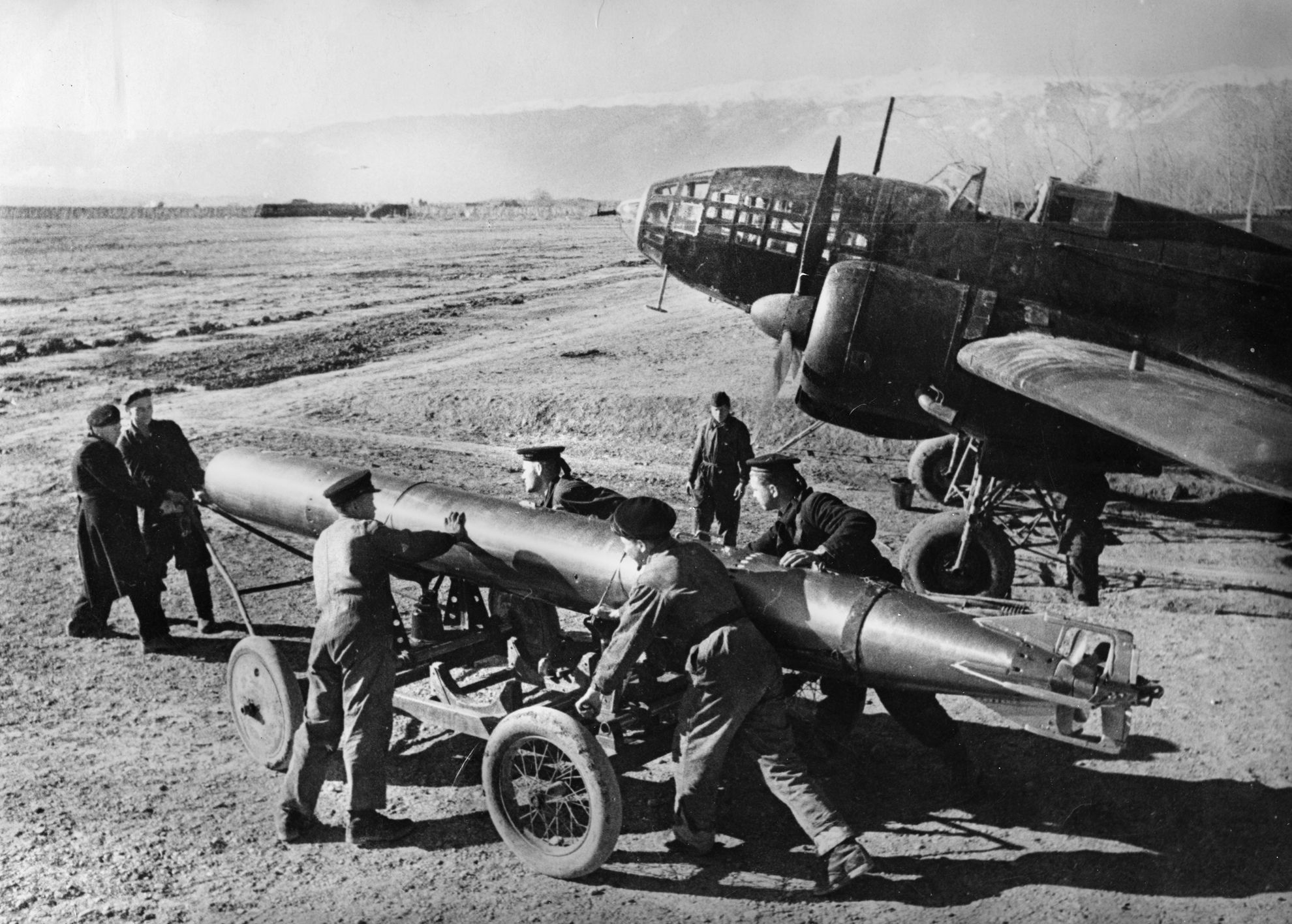 Soviet ground crewmen load a torpedo onto the versatile Ilyushin Il-4 twin-engined bomber. The Il-4 served as the backbone of the Soviet bomber corps throughout World War II.  