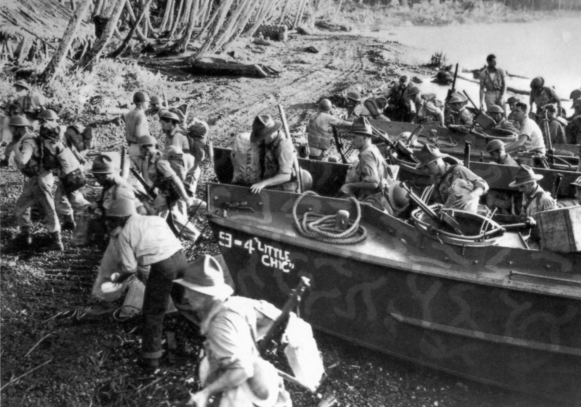 British soldiers exit landing craft and head into the thicket on a mission to relieve their American allies.