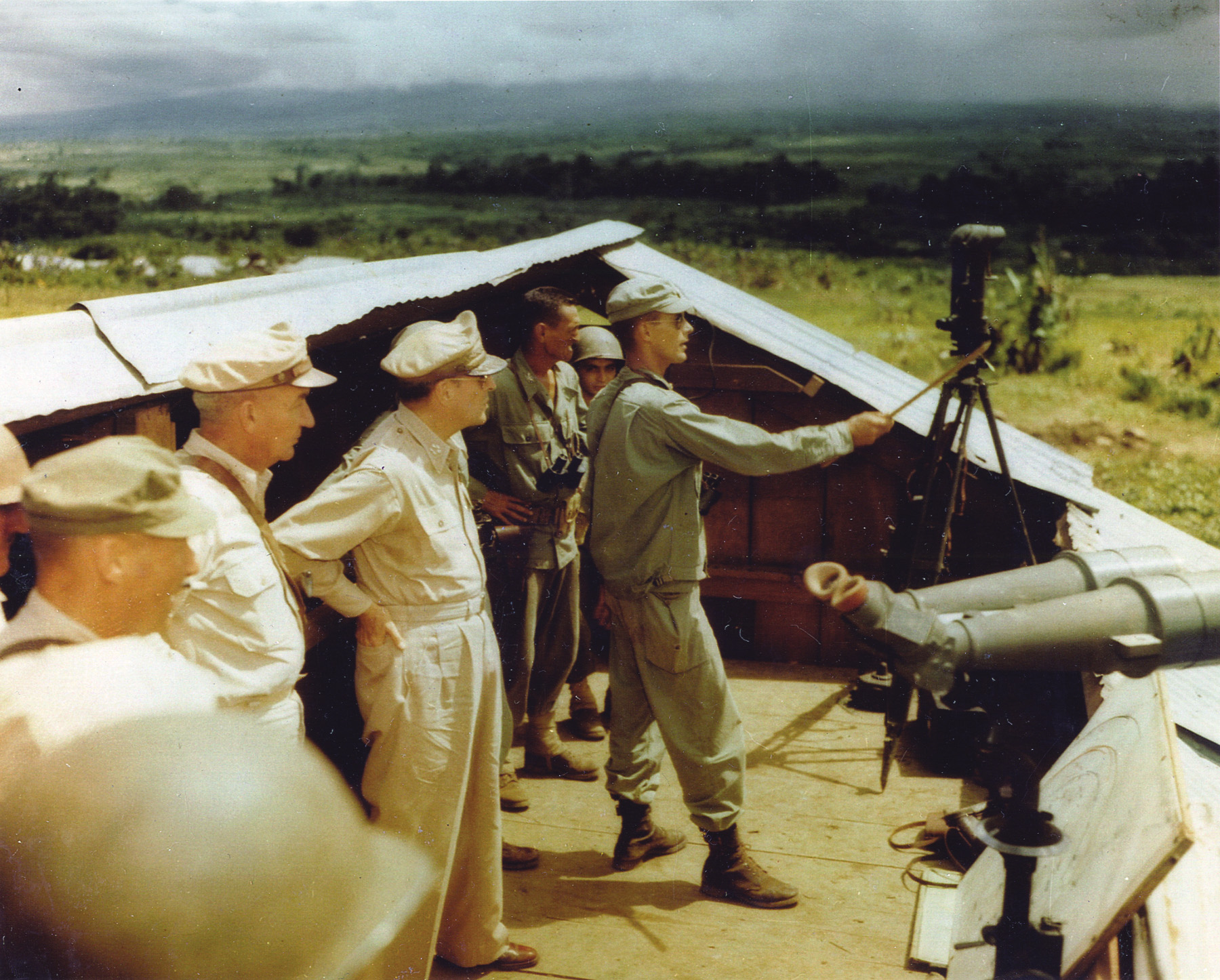 In order to better assess fighting conditions being endured by U.S. and British forces, General Douglas MacArthur and Lt. Gen. Robert Eichelberger take part in an island inspection.
