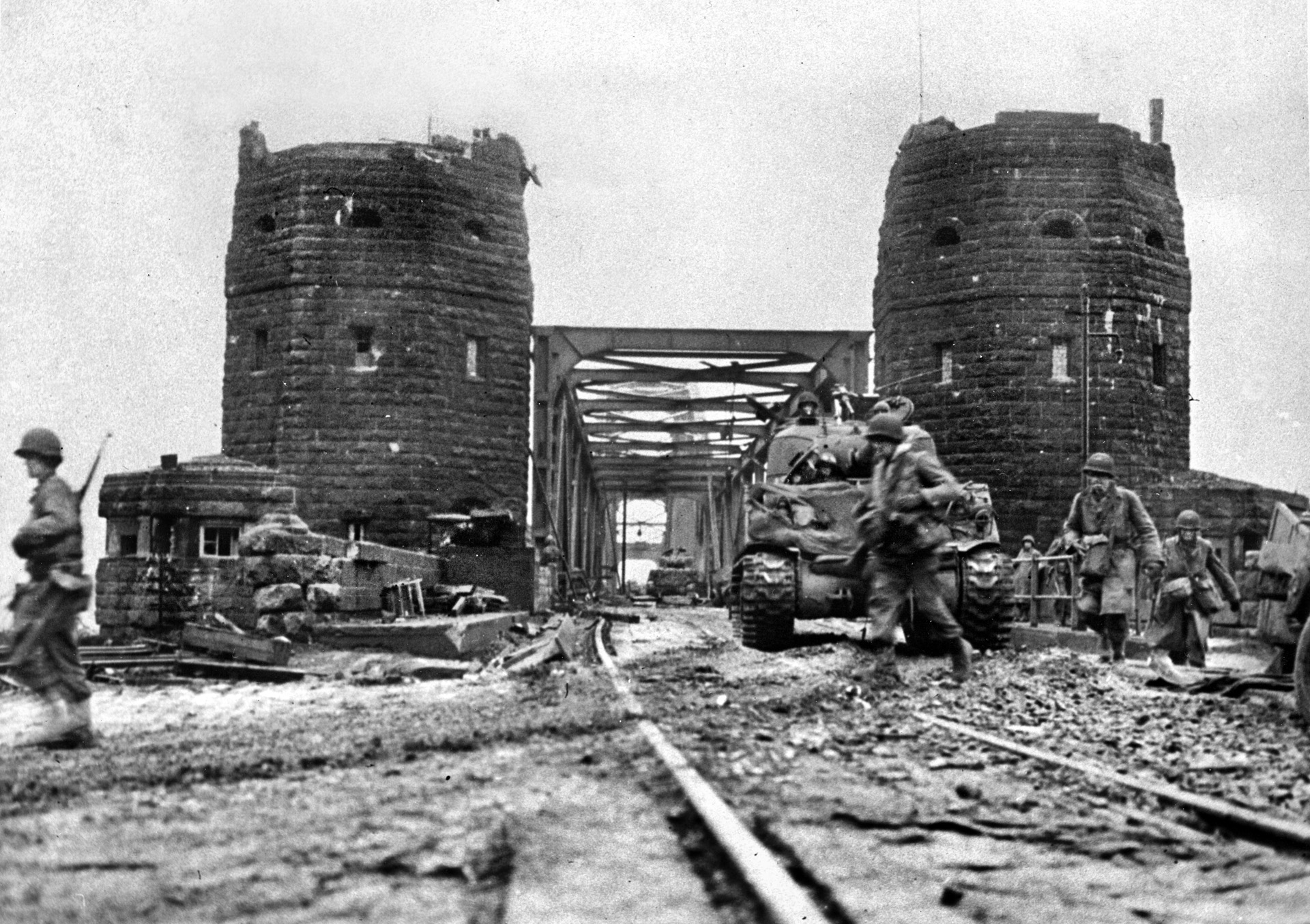 In this March 11, 1945, image, troops and M4 Sherman tanks of the U.S. First Army cross the Ludendorff railroad bridge to the eastern bank of the great Rhine River. The last natural barrier along the western frontier of Germany, the Rhine was also crossed by Allied armies in other locations.