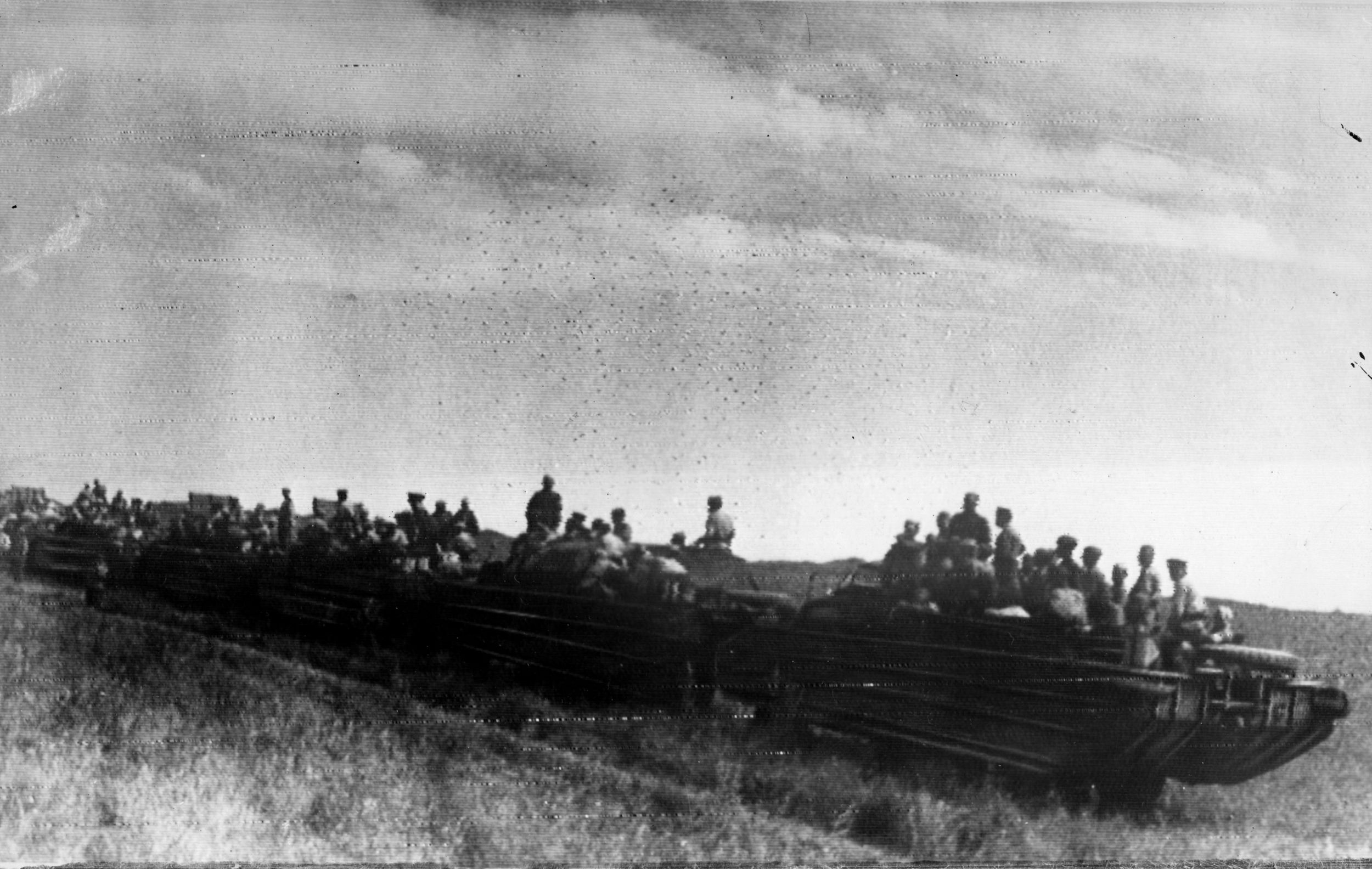 A Soviet motorized column moves up to forward positions in the steppes of Manchuria on the morning of August 9, 1945, in one of the last military operations of World War II.