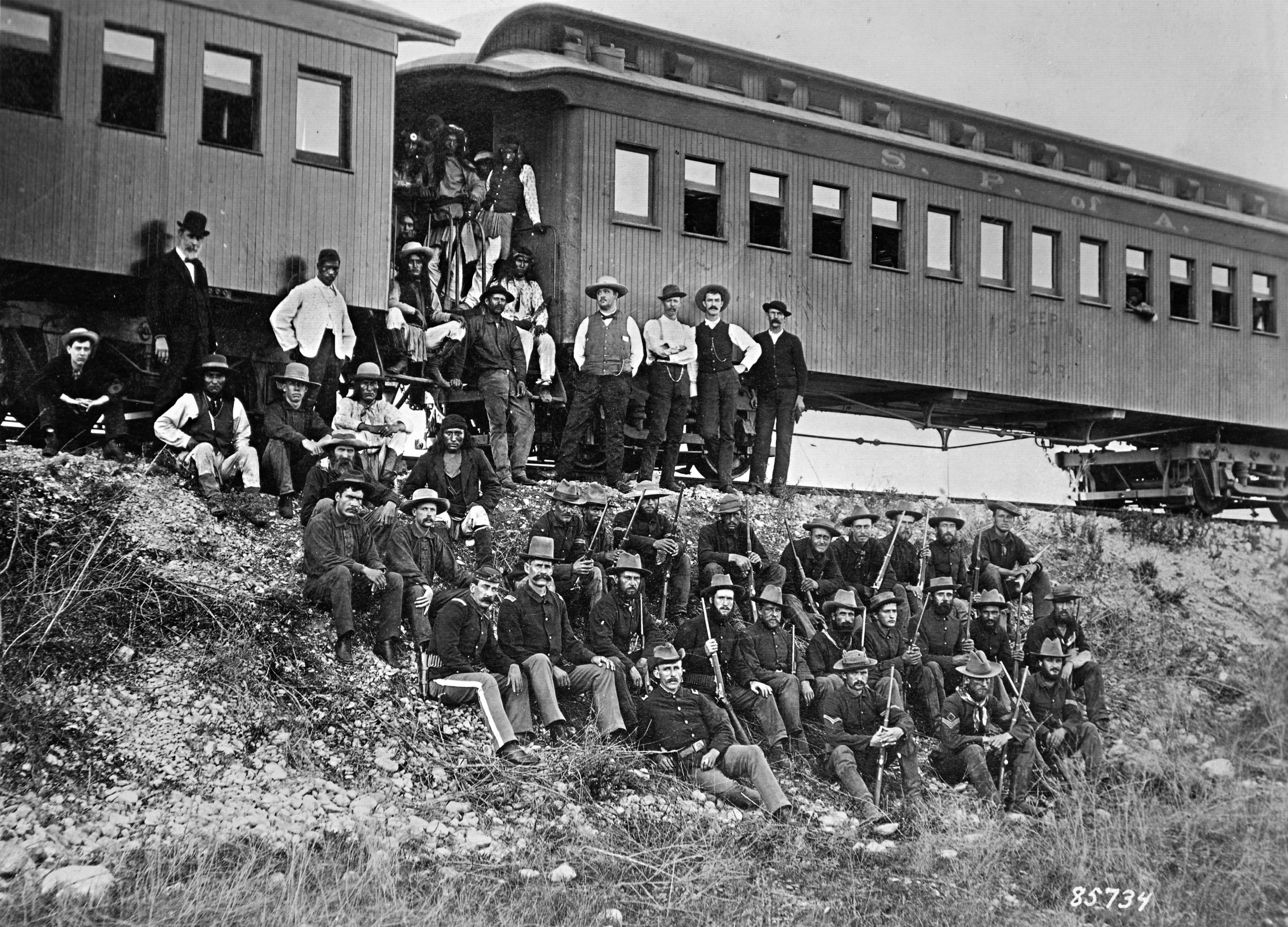 Lawton, lower center wearing the tall hat, photographed with B Troop, 4th Cavalry, during the forced relocation of Chiricahua Apaches from Arizona to Florida in 1886. Geronimo is pictured, center row, third from left.