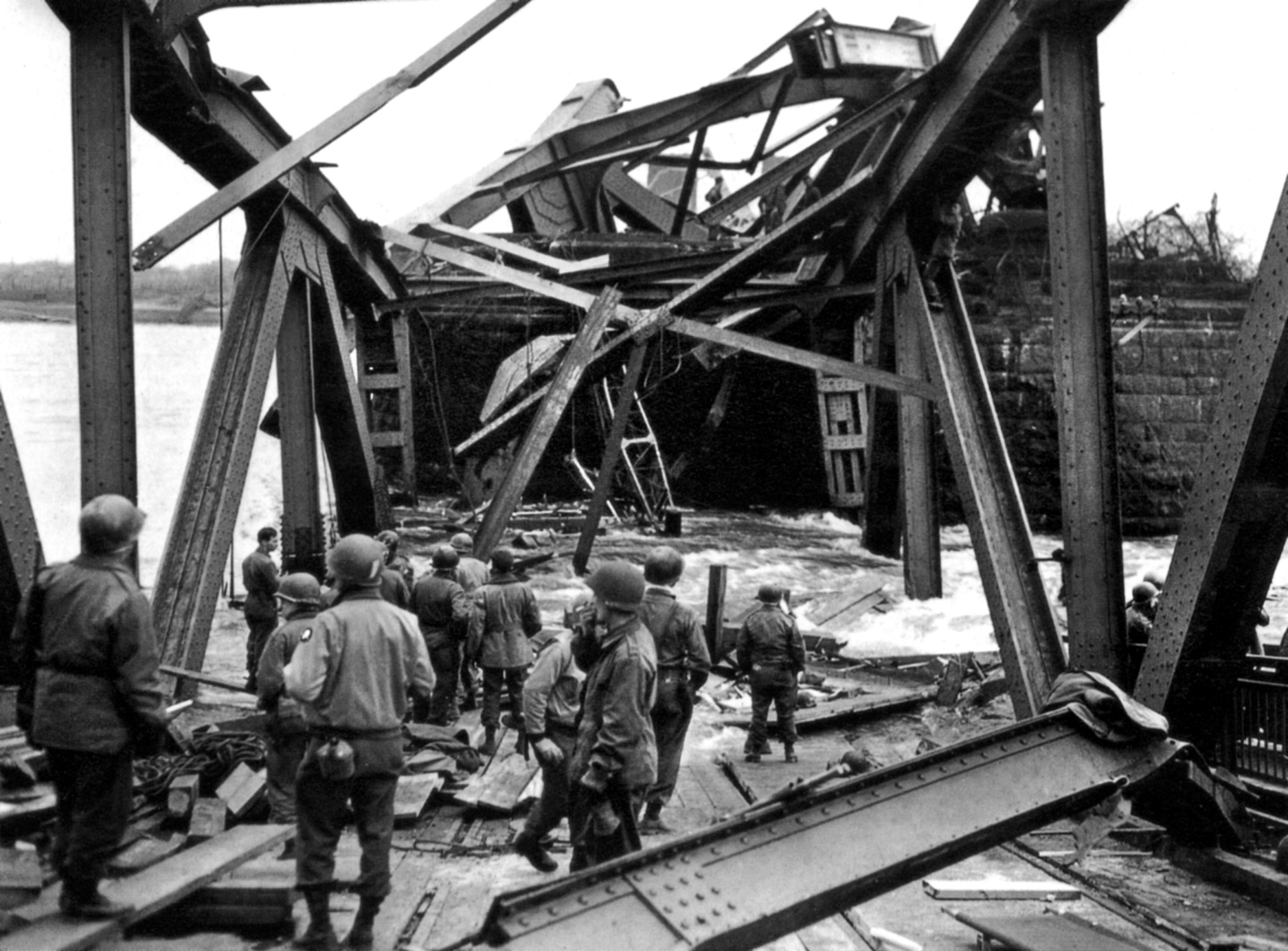 A mass of twisted steel is all that remains of the bridge after it crashed into the Rhine on March 17, 1945. Twenty-eight American soldiers were killed in the collapse of the structure just over a week after it was captured intact by the 9th Armored Division.