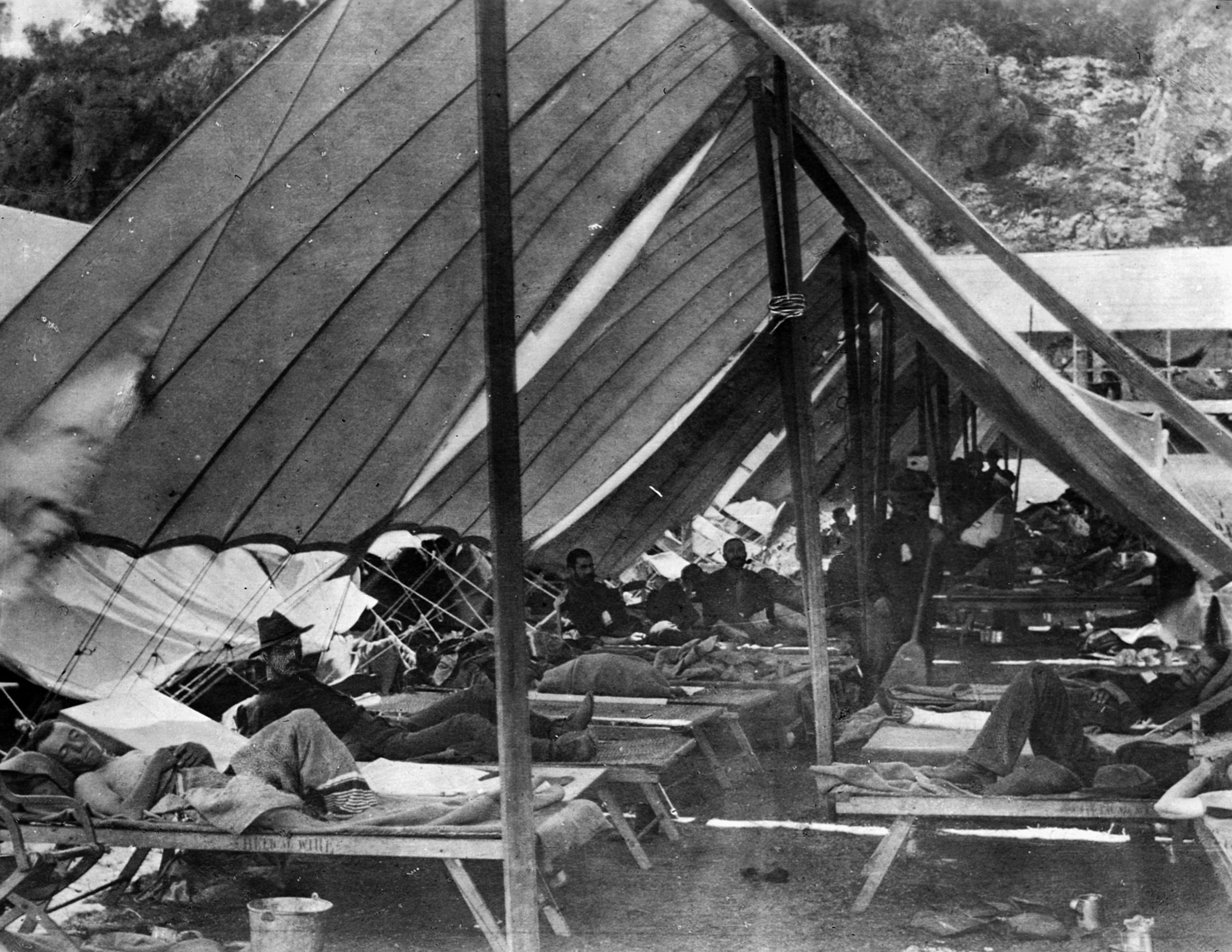 Injured soldiers recover in a U.S. Army hospital tent in Sibouny on July 8, 1898. 