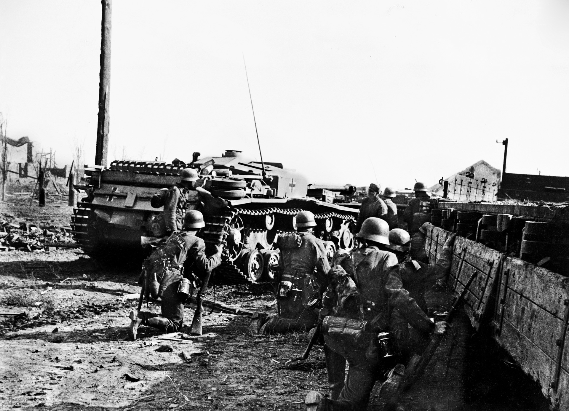 German infantrymen follow their armored vehicles on the advance into Stalingrad. Few if any of the Nazi soldiers would survive the meat-grinder battle.