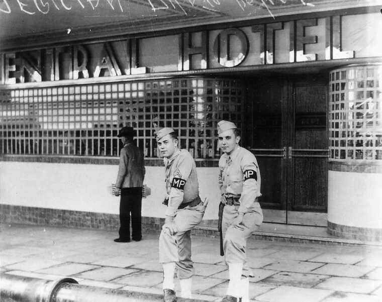 American MPs stand watch on a Brisbane street. Often called upon to break up fights between U.S. and Australian personnel, law enforcement organizations faced hazardous duty.