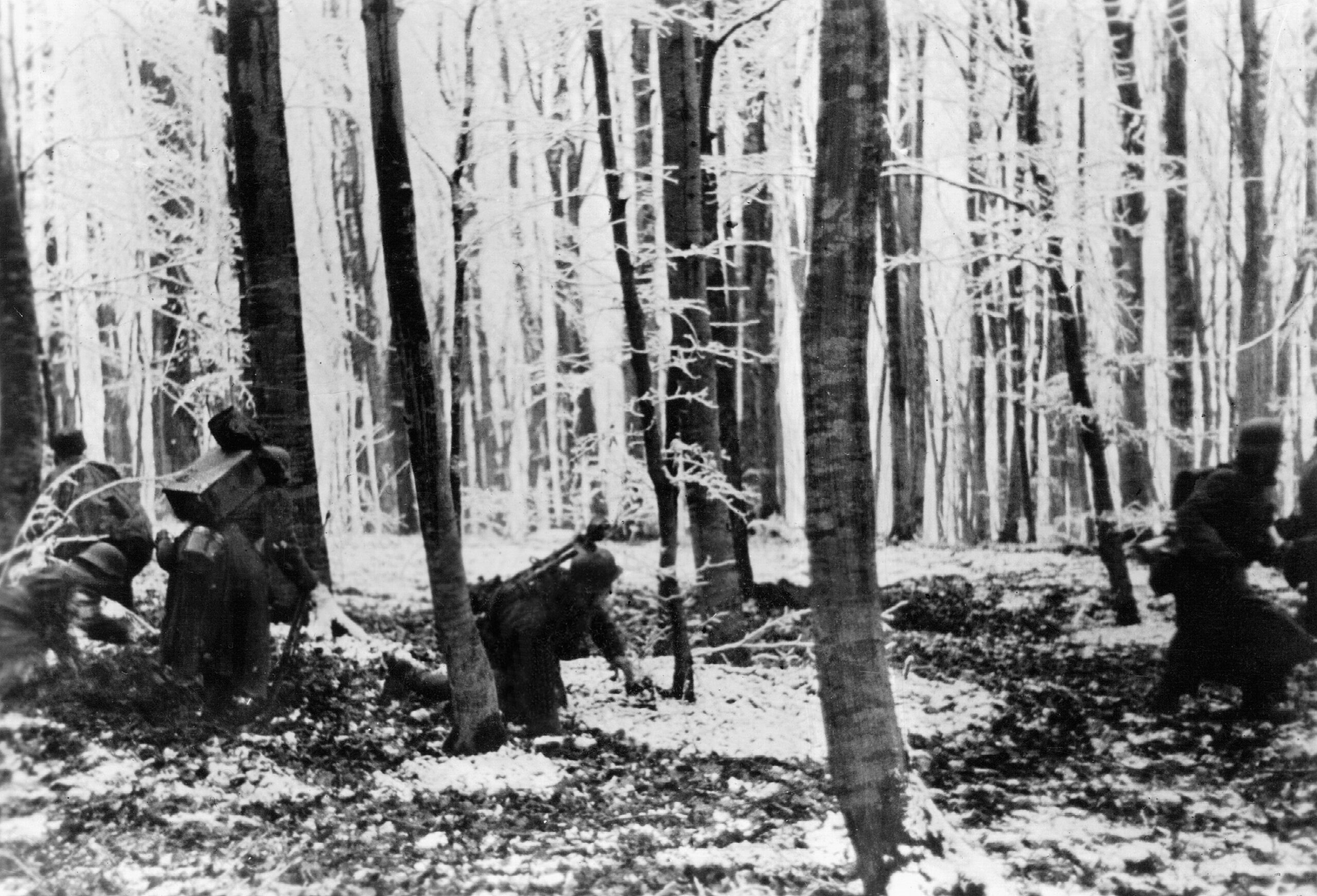 On January 15, 1945, German infantrymen pick their way through a wooded area during the costly Ardennes offensive. Hitler’s bid to capture the port of Antwerp and split the Allied armies in the West ended in failure.