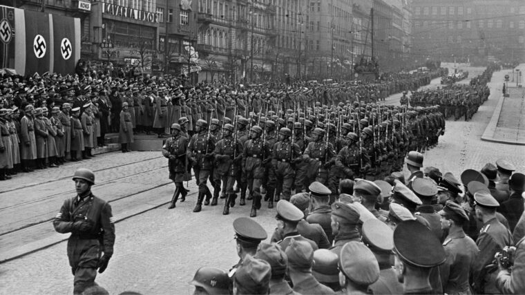 Strutting through the streets of Prague, German paratroopers participate in a military parade after the occupation of Czechoslovakia in 1939.