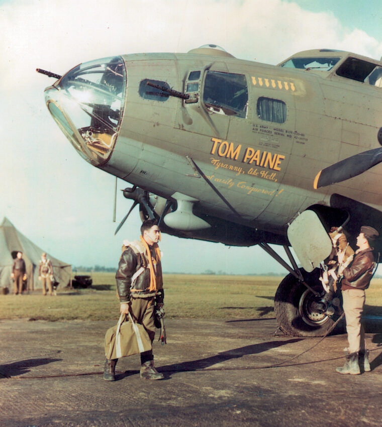 A B-17 nicknamed “Tom Paine” sits ready to begin a mission as its crew loads up for the coming flight. The bomber’s base was near the birthplace of American patriot Thomas Paine in Thetford, England.