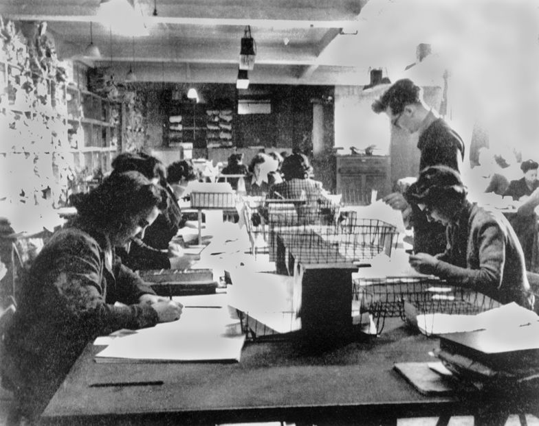 In Hut 3 at Bletchley Park, civilian and military personnel work together to decipher intercepted German communications.