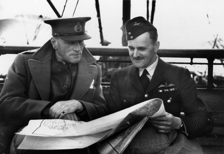 British General Claude Auchinleck and Royal Air Force Group Captain M. Moore confer during operations in Norway. 