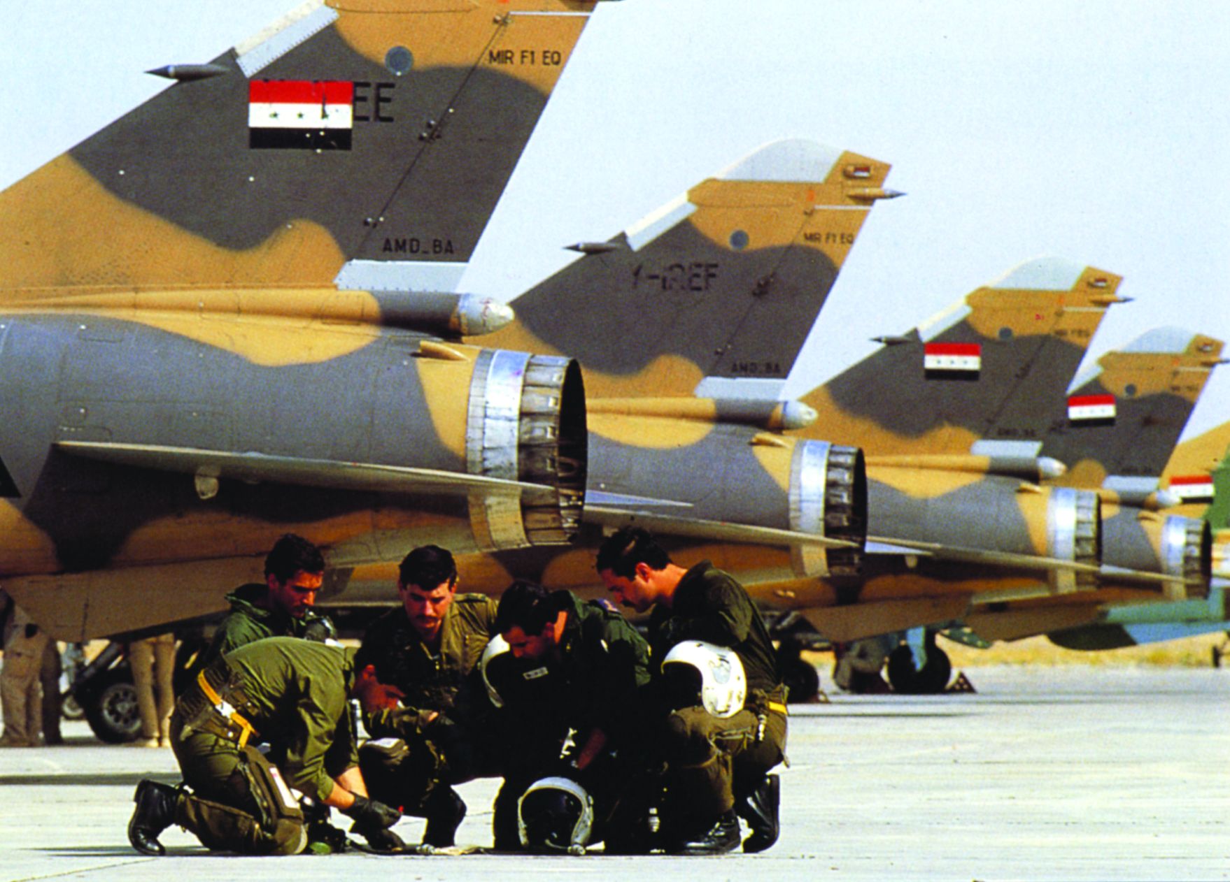 Iraqi pilots undergo a last-minute briefing beneath their Mirage F-1 fighter-bombers. The better-equipped Iraqis controlled the skies. 