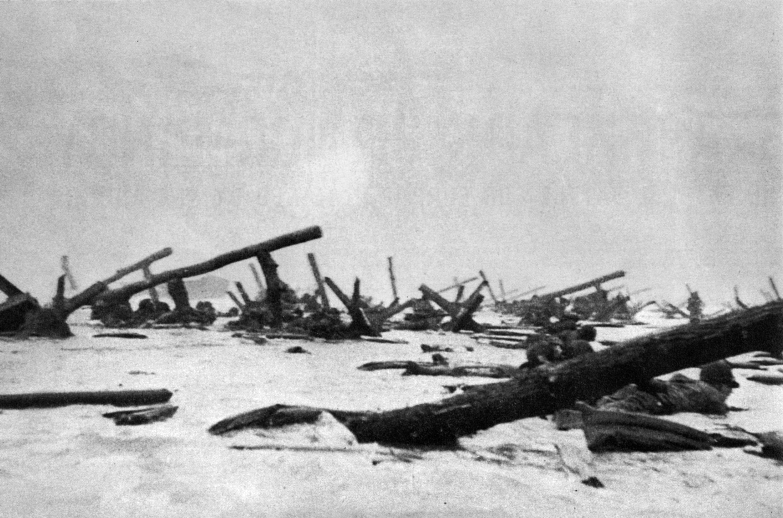 These two iconic images of the landings at Omaha Beach on D-Day were captured by Life magazine photogra- pher Robert Capa. The impetuous photographer accompanied U.S. troops to Omaha Beach and hurriedly snapped a number of frames at the sector code-named Easy Red Beach. When the rolls of film were delivered for developing, an overanxious technician dried the emulsions too quickly and destroyed all but 10 of the pho- tographs Capa had risked his life to obtain.