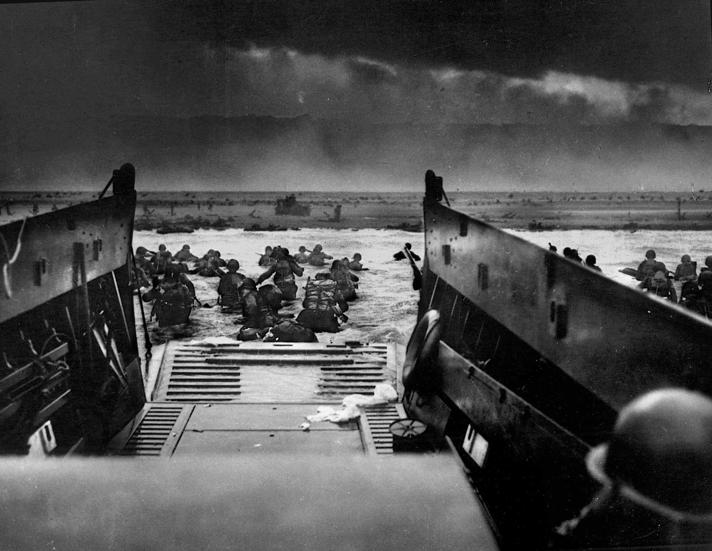 Soldiers of the U.S. 16th Infantry Regiment, 1st Infantry Division assaulted Omaha Beach along with the troops of the 29th Infantry Division on D-Day. These men of Company E, 16th Regiment have just exited their Higgins boat, which embarked from the transport USS Samuel Chase.