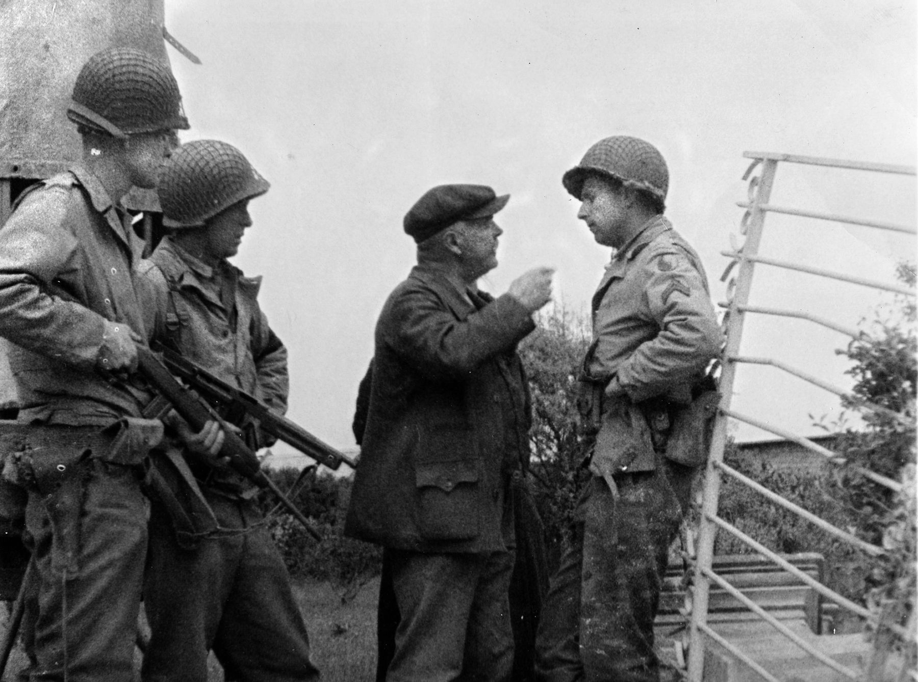 Several weeks after the Allied landings in Normandy, soldiers of the 29th Infantry Division ask a Frenchman for information. Although the landings of June 6, 1944, were successful, the action at Omaha Beach was by far the costliest for the Allies. The landings there had taken place in the early morning, and several hours later the issue remained in doubt, causing General Omar Bradley, commander of U.S. ground forces in Normandy, to contemplate withdrawing the troops from Omaha Beach.