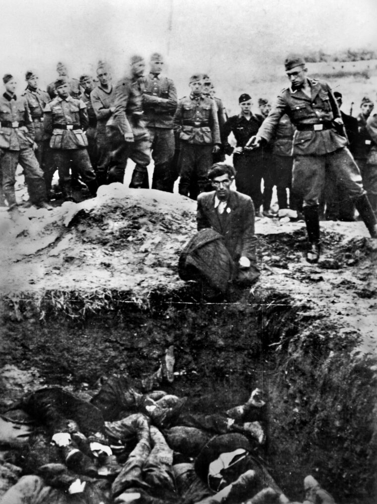In this well-known photograph, a member of a Nazi SS Death Squad murders a captive adjacent to a pit into which his body will fall following the fatal shot. Such photographs were used as evidence against former members of Einsatzgruppen after World War II. 