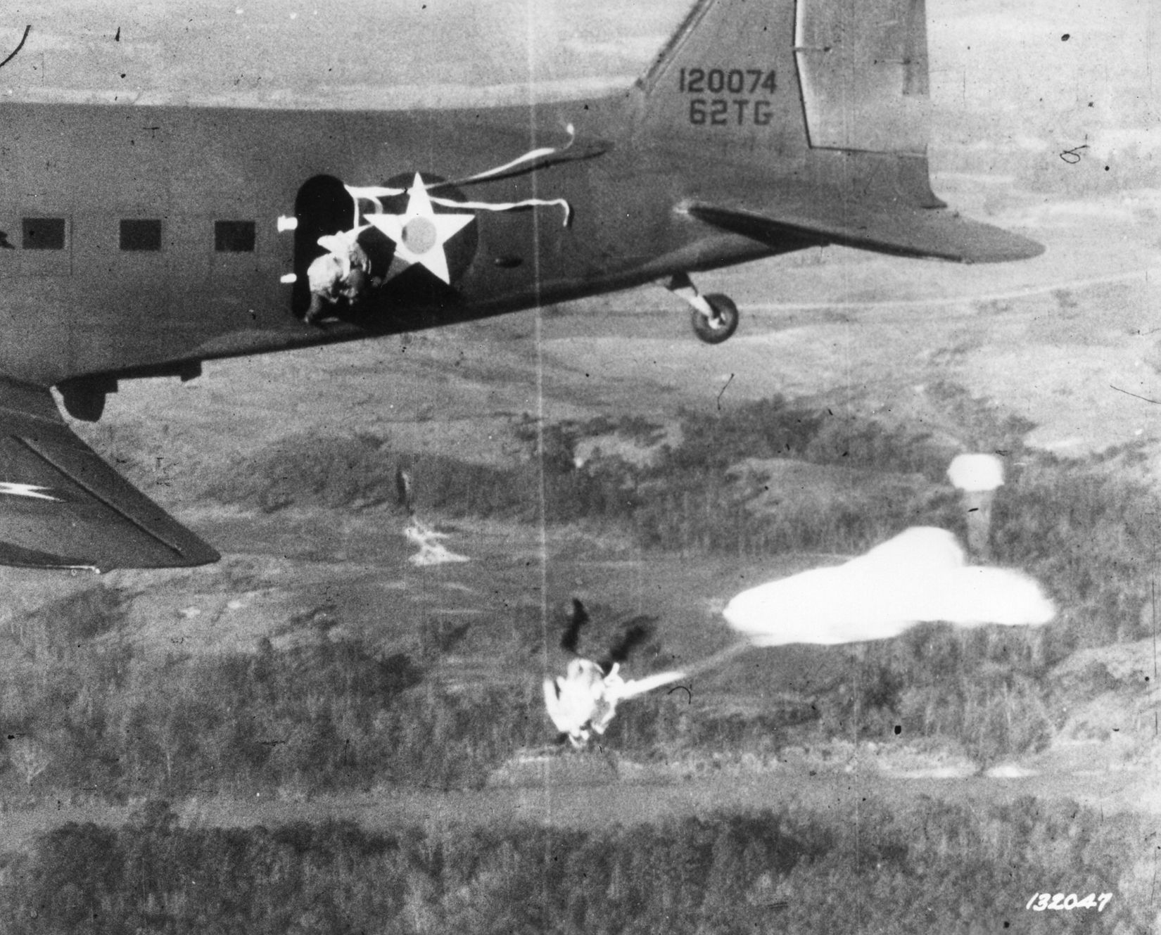 Paratroopers jump from a C-47 over Fort Benning, Georgia, where Mauser earned his wings. He would complete his stateside training at Fort Bragg, North Carolina.