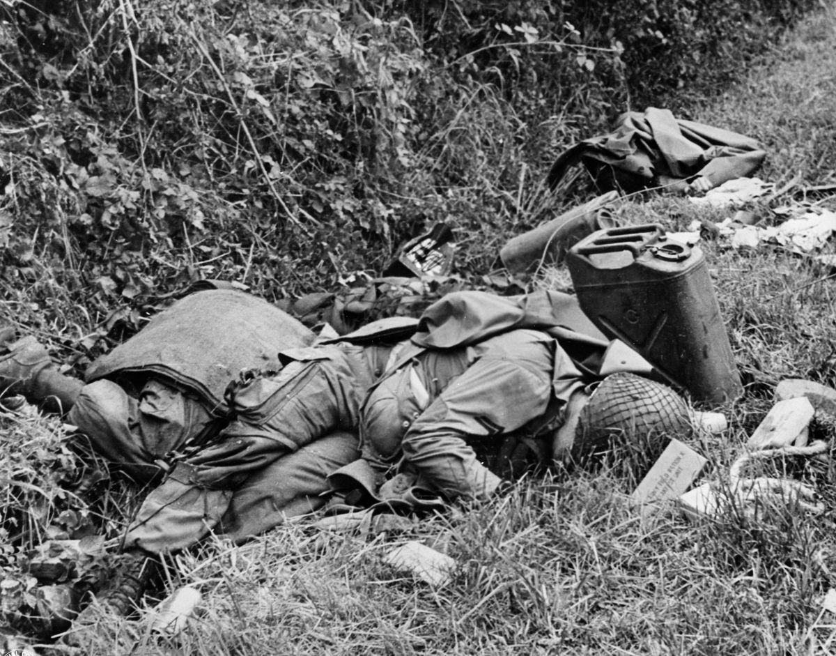 An Airborne soldier lies dead near Ste. Mere du Mont, near Utah Beach. The first dead soldier Mauser encountered was his friend Benjamin Stoney.