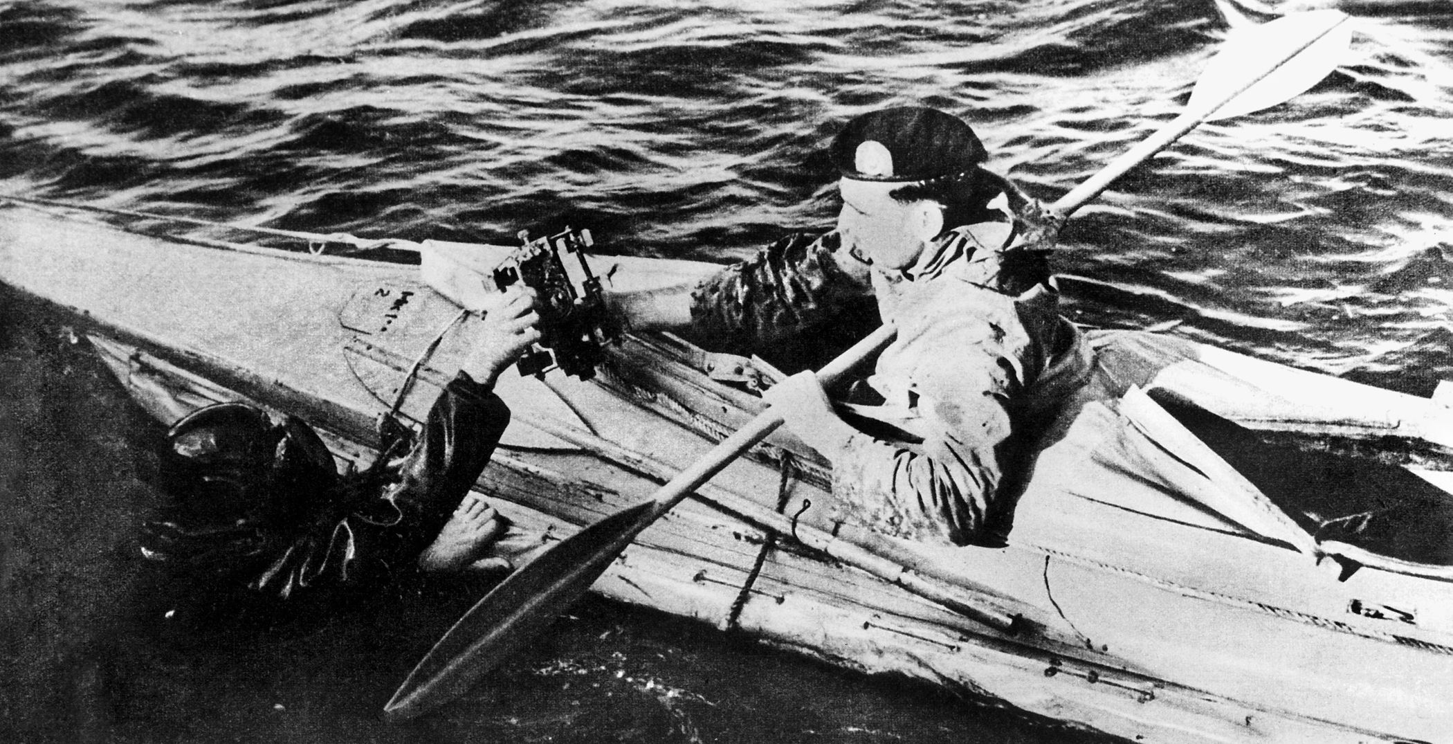 Two commandos handle a limpet mine during traing for Operation Frankton. 