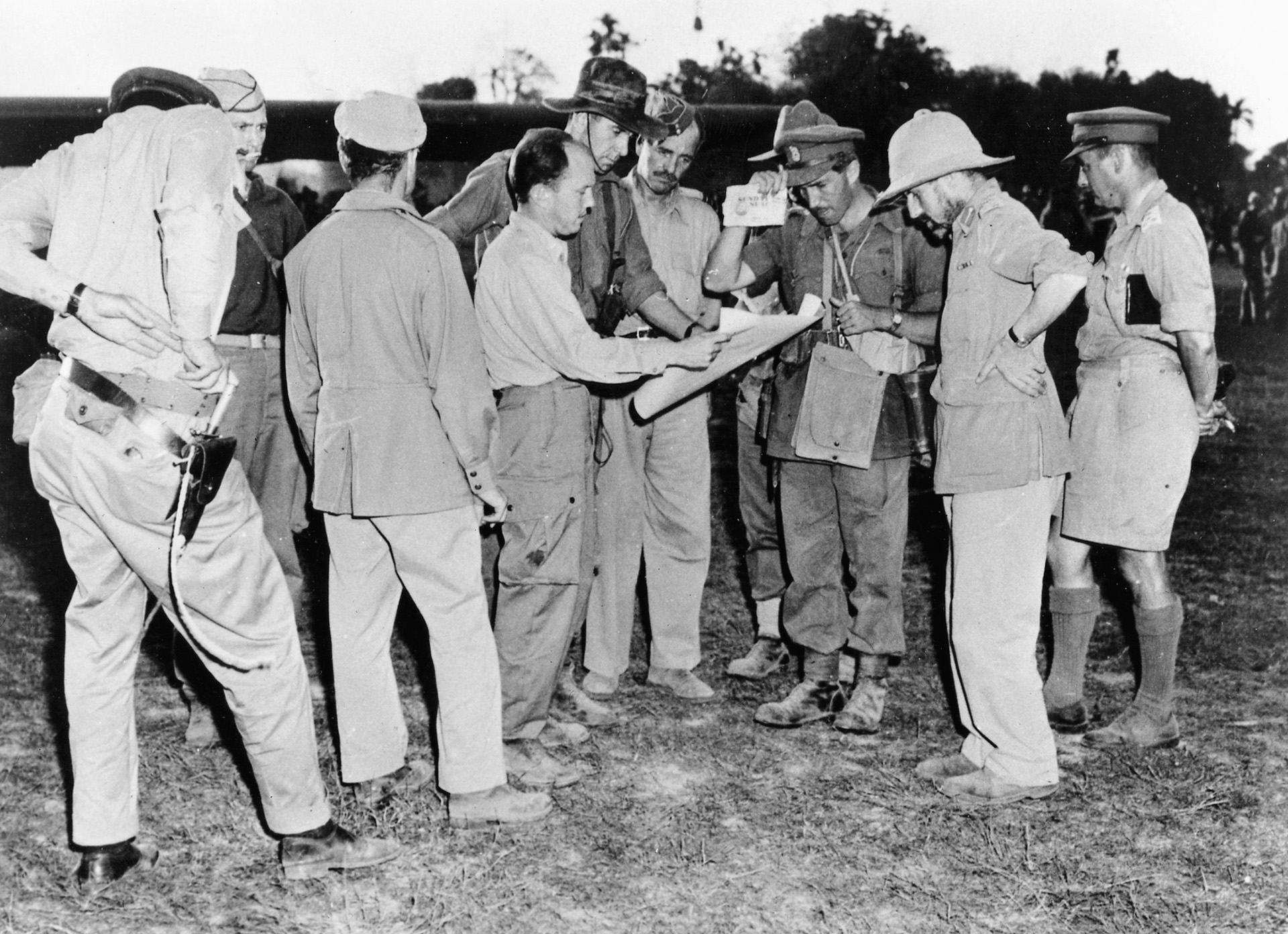 Brig. Gen. Orde Wingate, commander of the Chindits in Burma (far right), briefs staff officers before take-off near the main base at Sylhet, Assam. To Wingate’s immediate right, is Mike Calvert.