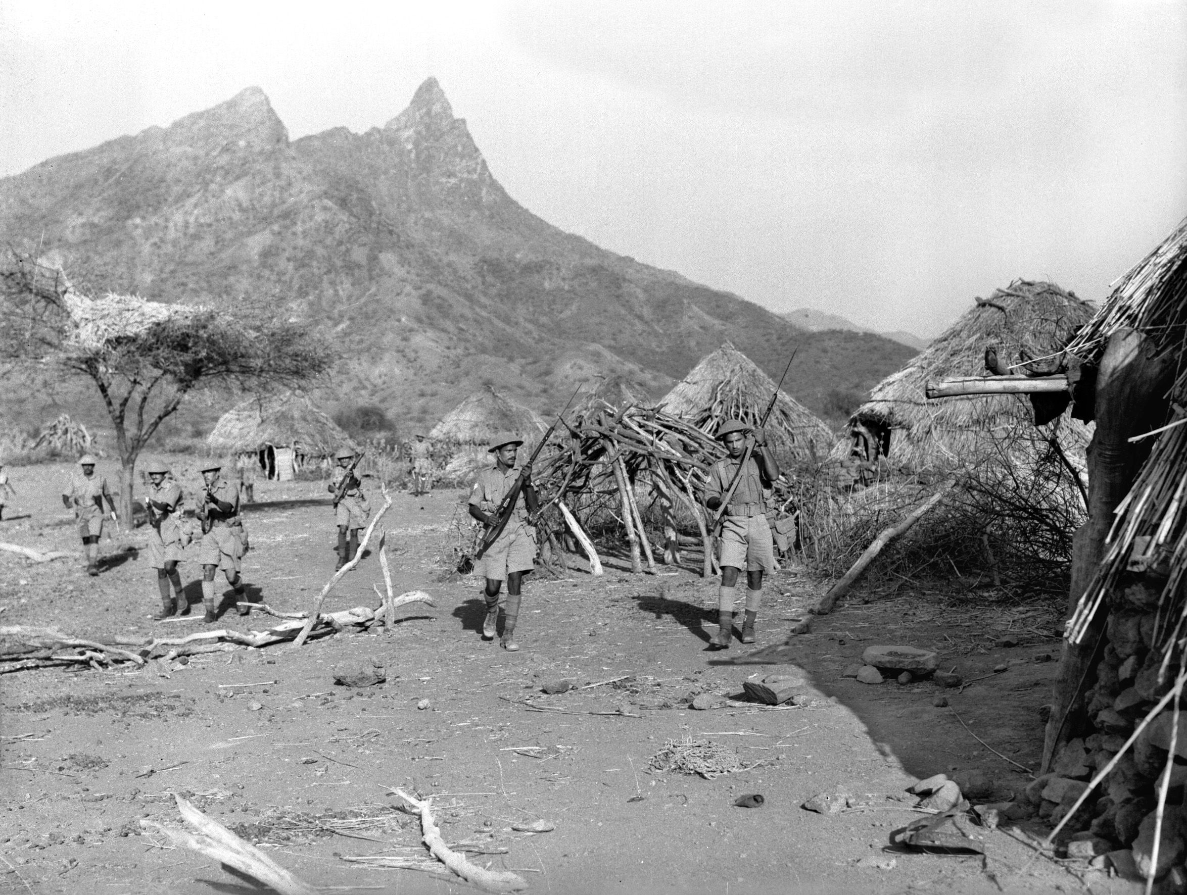 Ethiopian soldiers clear a native village in the Italian province of Eritrea in the spring of 1941. The Italians had invaded Ethiopia on October 3, 1935, and eventually overran the country, sending Haile Selassie into exile.