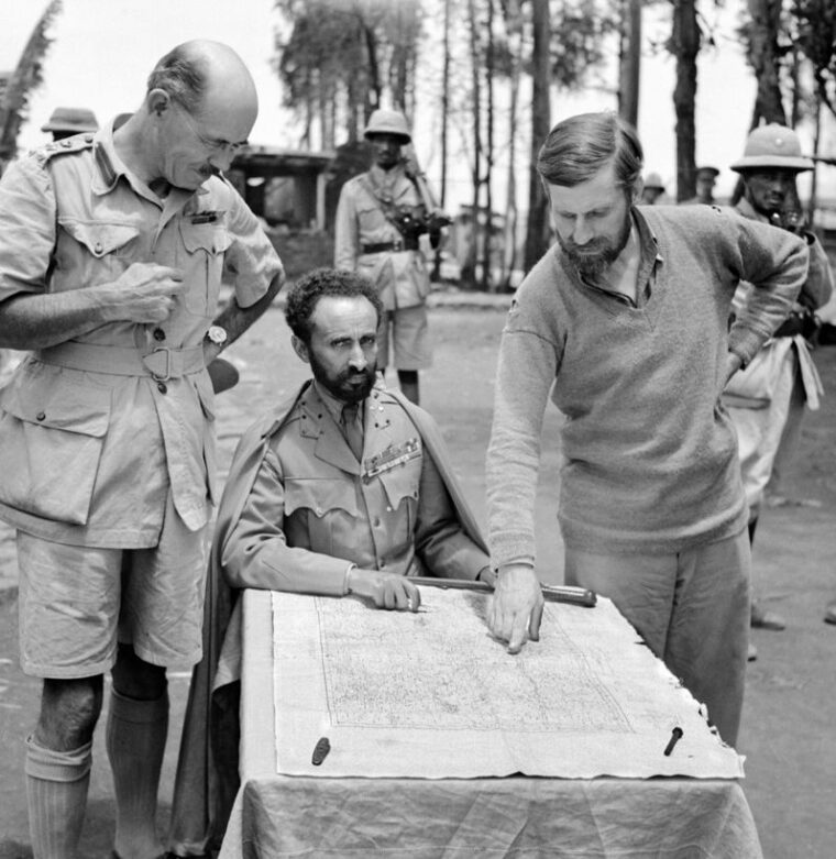 Photographed following the capture of Dambacha Fort on April 15, 1941, Emperor Haile Selassie (center) is flanked by British Brigadiers Orde Wingate (right) and D.A. Sandford.