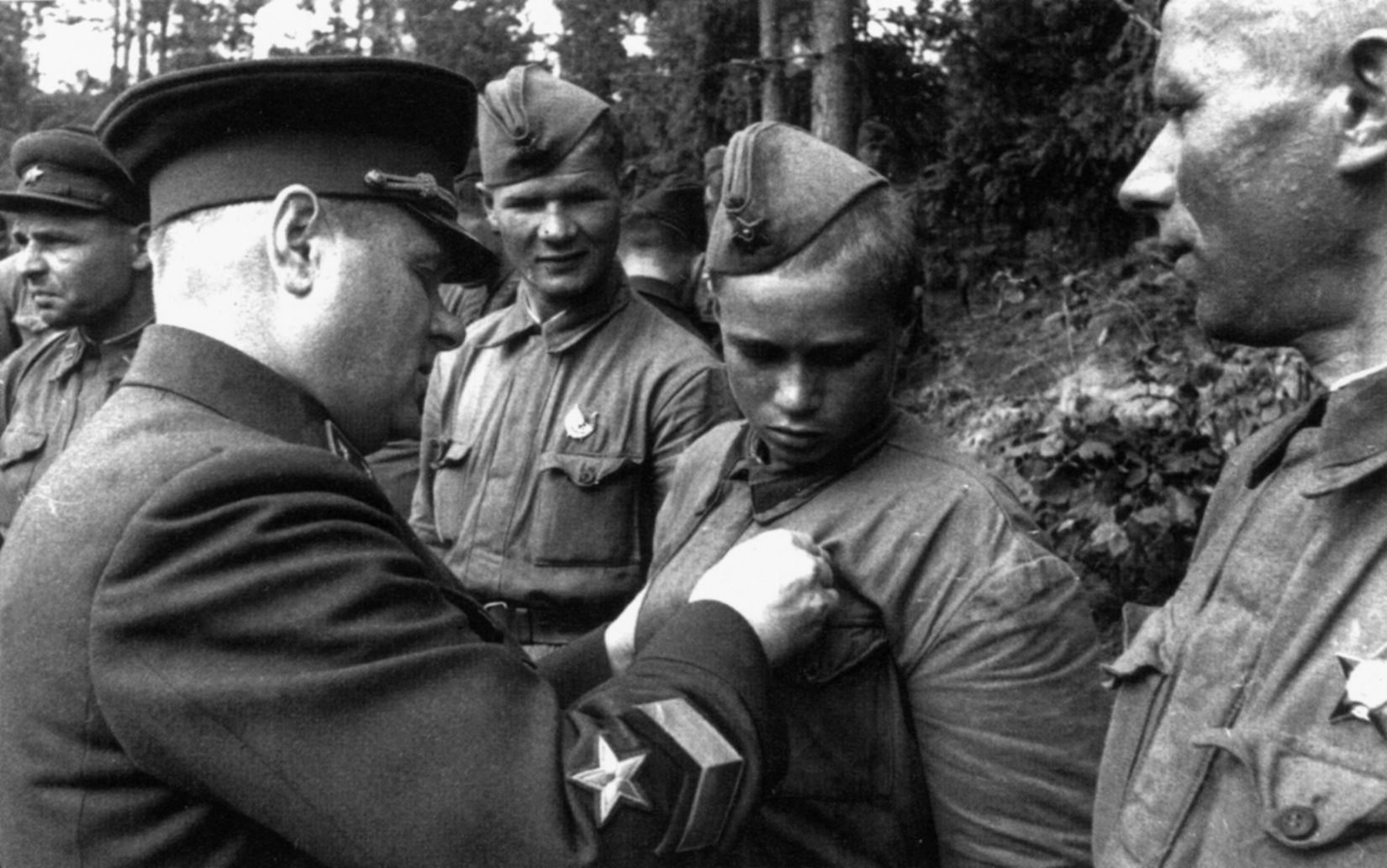 Red Army General Kirill Meretskov decorates a young Soviet soldier for heroism on the battlefield. The Soviets sacrificed thousands of troops in their effort to break the German ring around Leningrad. 