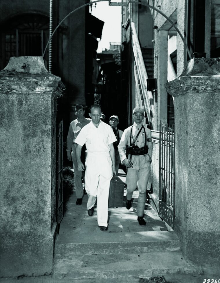 Members of the OSS arrest Gestapo leader in Canton, China, in the 1940s.