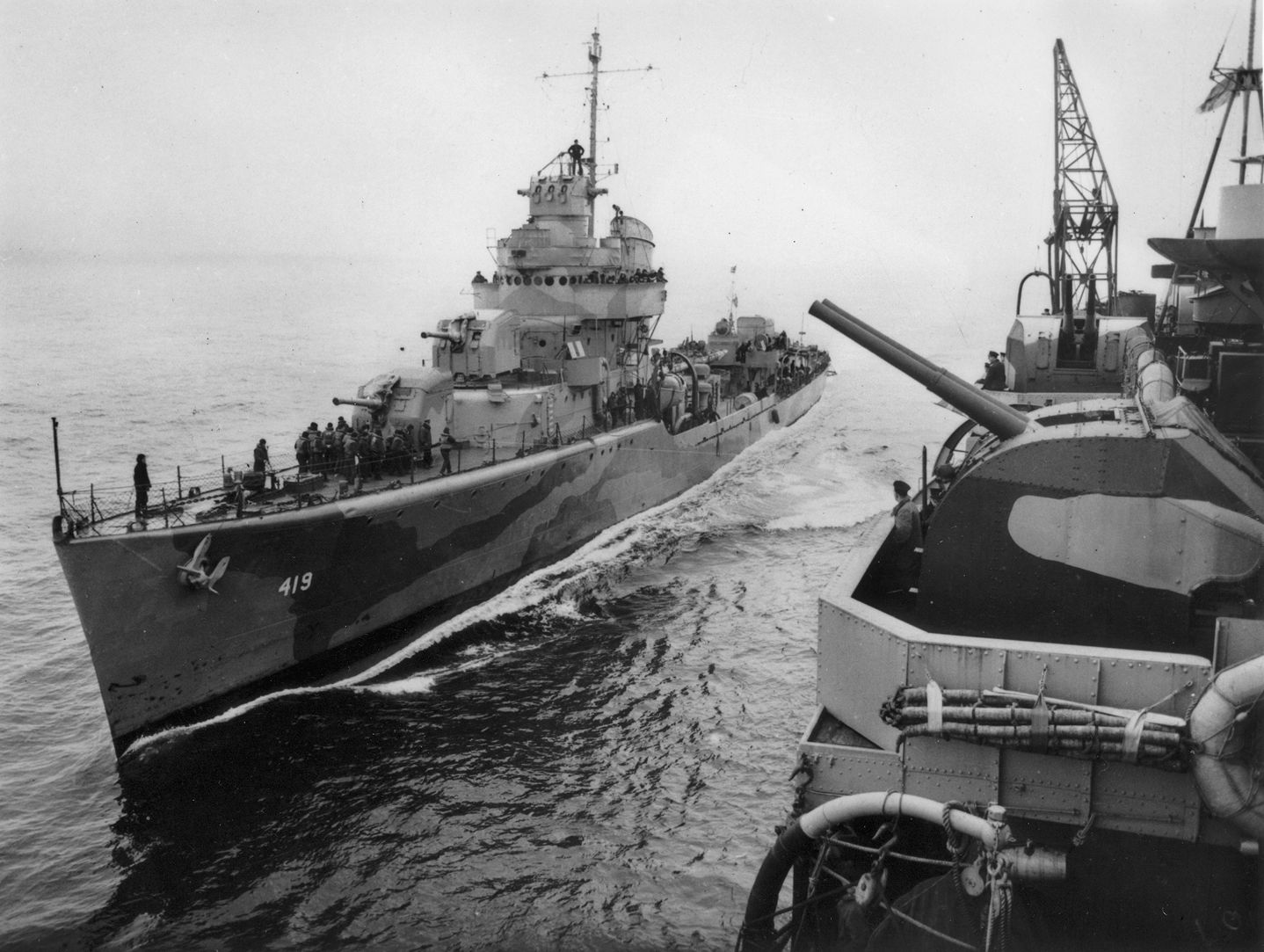 The destroyer USS Wainwright comes alongside another warship to take on fuel. During its escort duties with Convoy PQ-17, Wainwright was instrumental in beating back German air attacks.