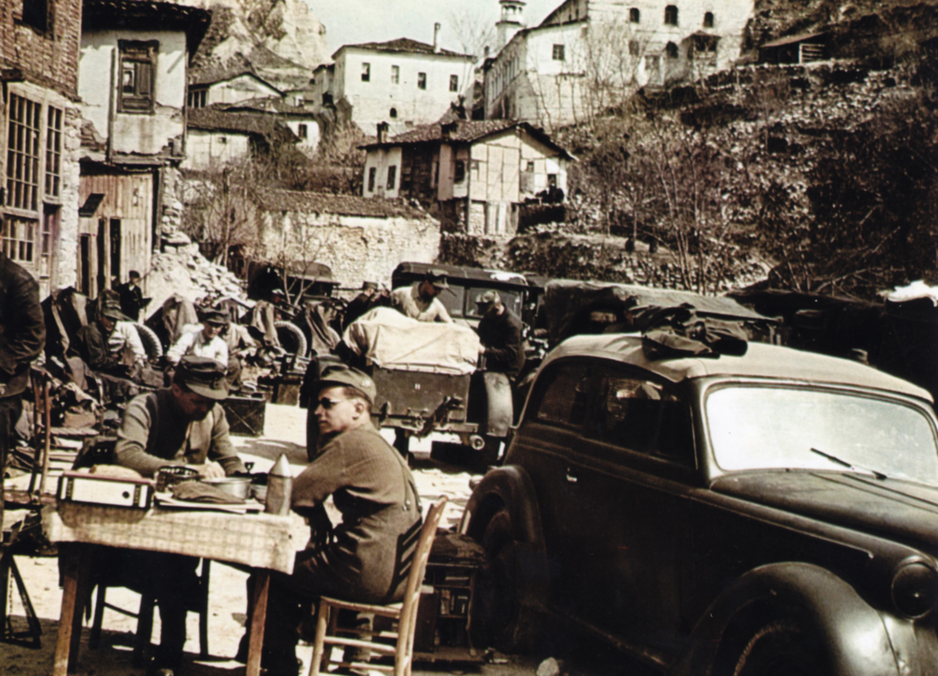 German Alpine troops relax at a table in a small Bulgarian town. Hitler’s Eastern European allies were restive at times, requiring action on the part of the Fuhrer to keep them in line.