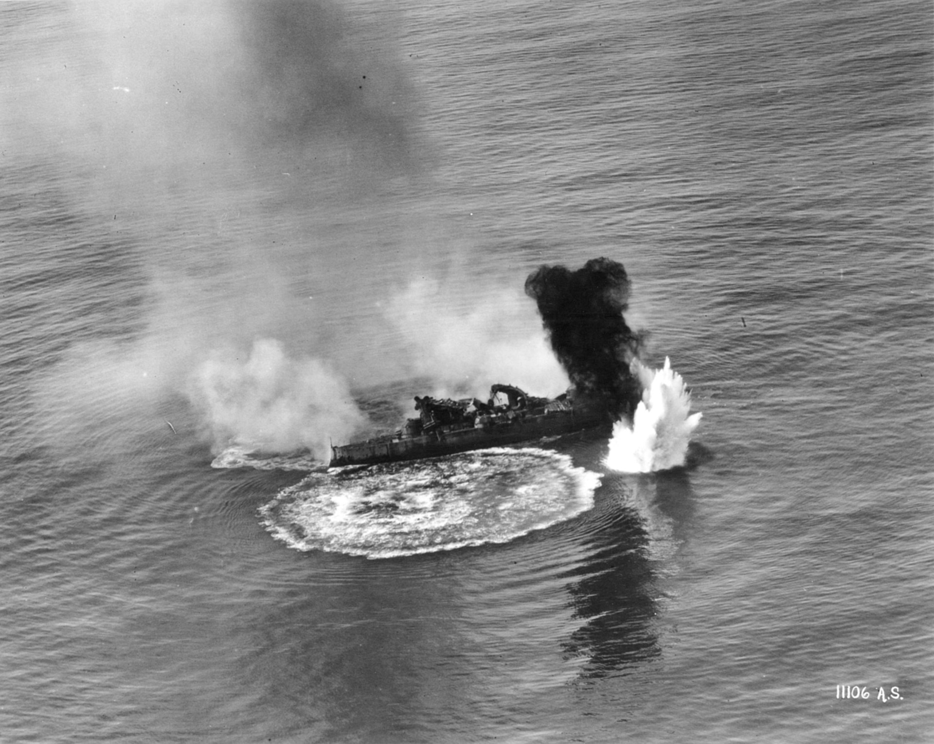 During an aerial bombing exercise, the obsolete battleship USS Virginia takes a direct hit.